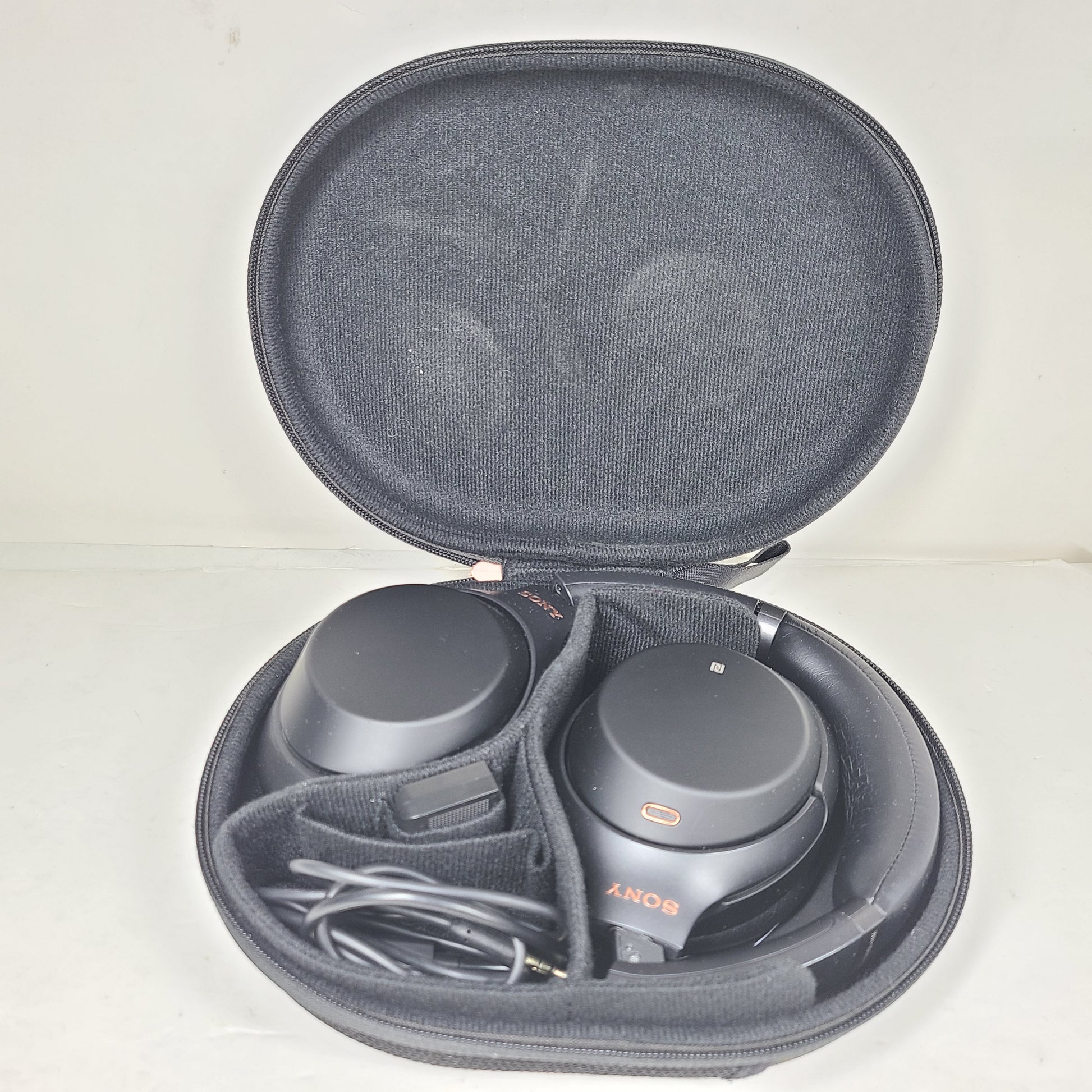 Black Sony WH-1000XM3 wireless over-ear headphones with active noise cancellation and cushioned ear pads for extended comfort.