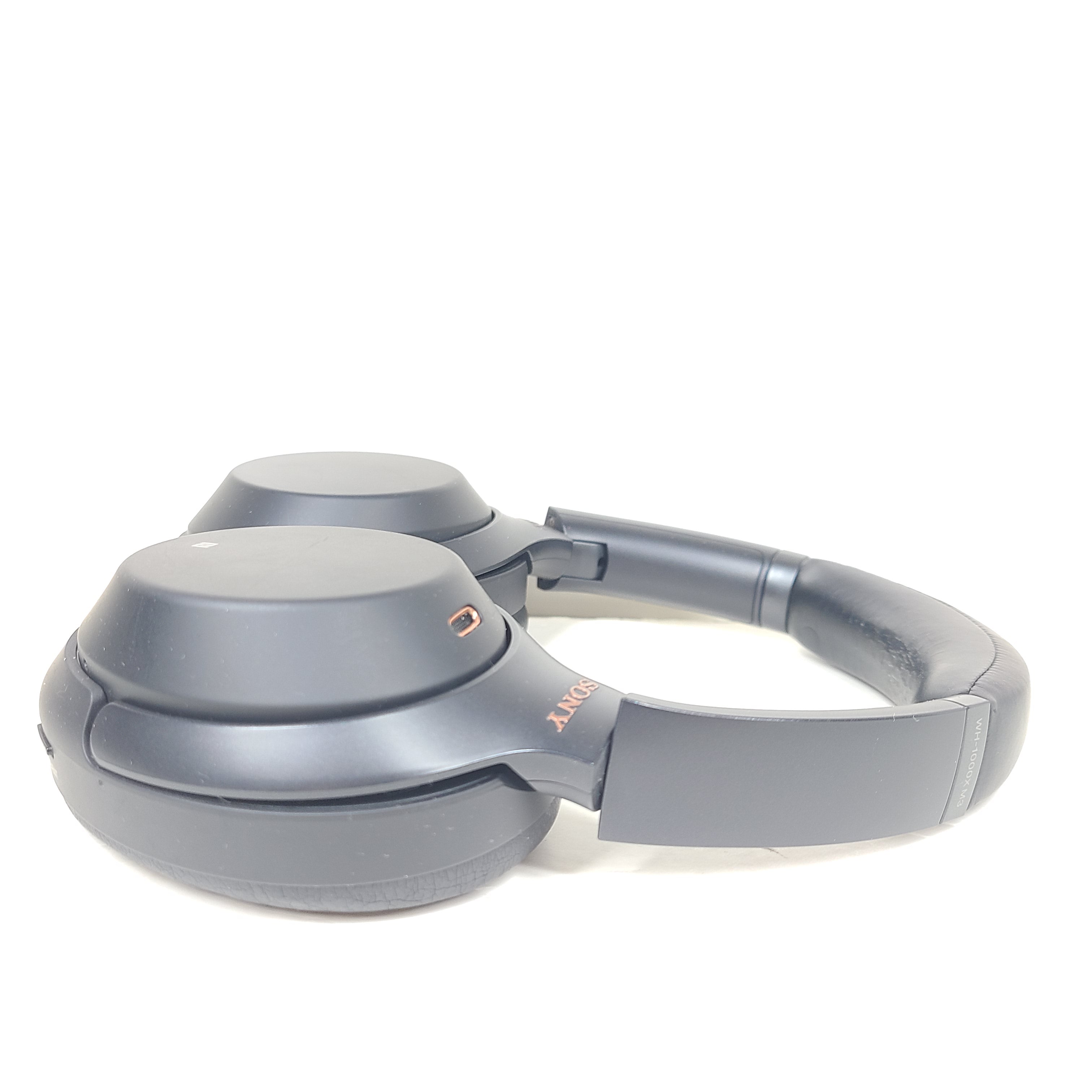 Black Sony WH-1000XM3 wireless over-ear headphones with active noise cancellation and cushioned ear pads for extended comfort.