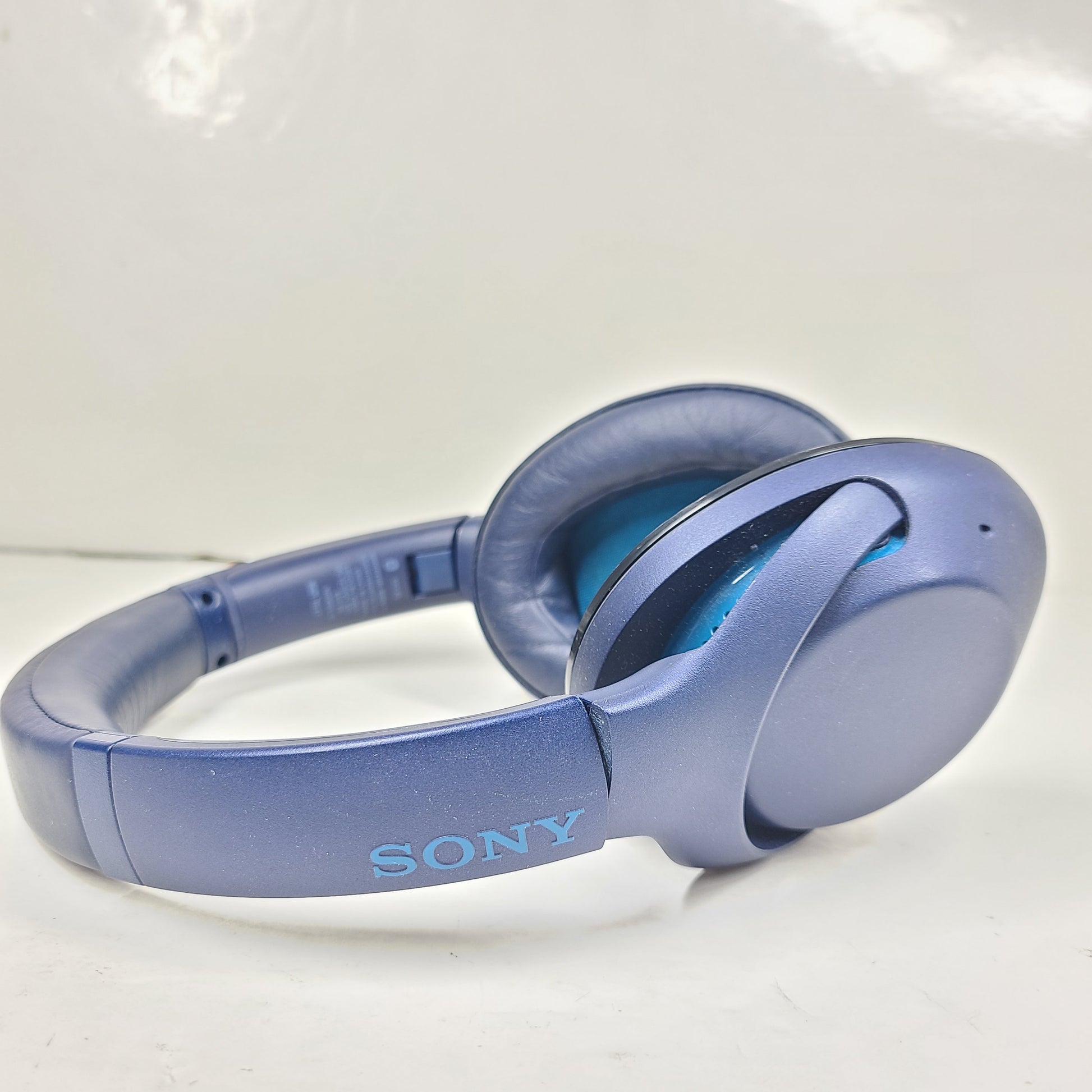 Over-ear Sony WH-XB900N wireless headphones in blue with active noise cancellation and emphasized bass.