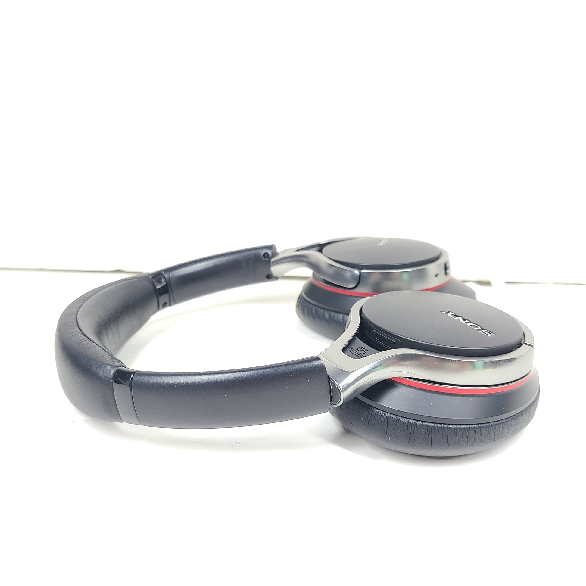 Black Sony MDR-10RNC on-ear noise-cancelling headphones with DIGITAL NC labeling and attached cable.