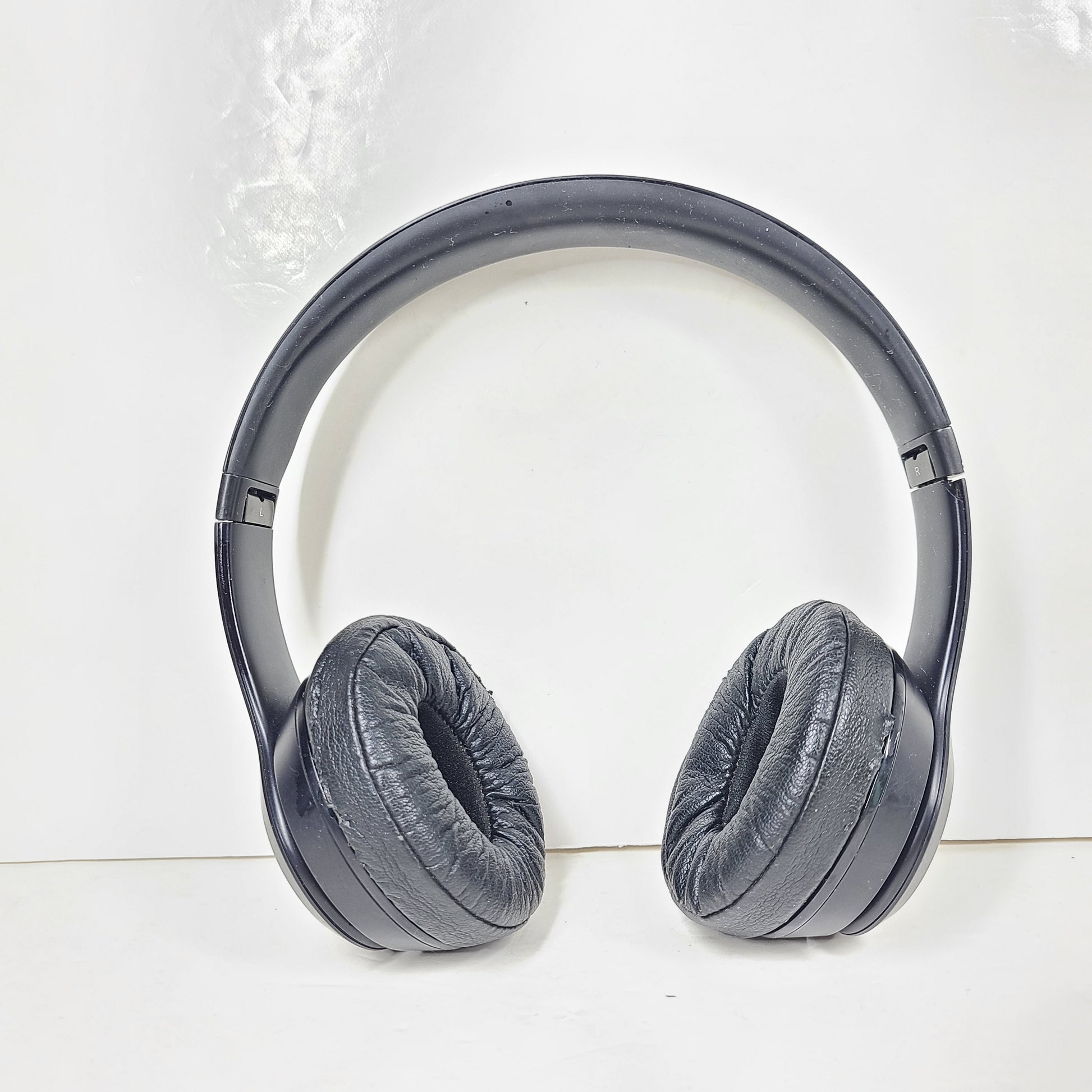 Black Beats Solo3 Wireless on-ear headphones with cushioned ear cups and adjustable headband.