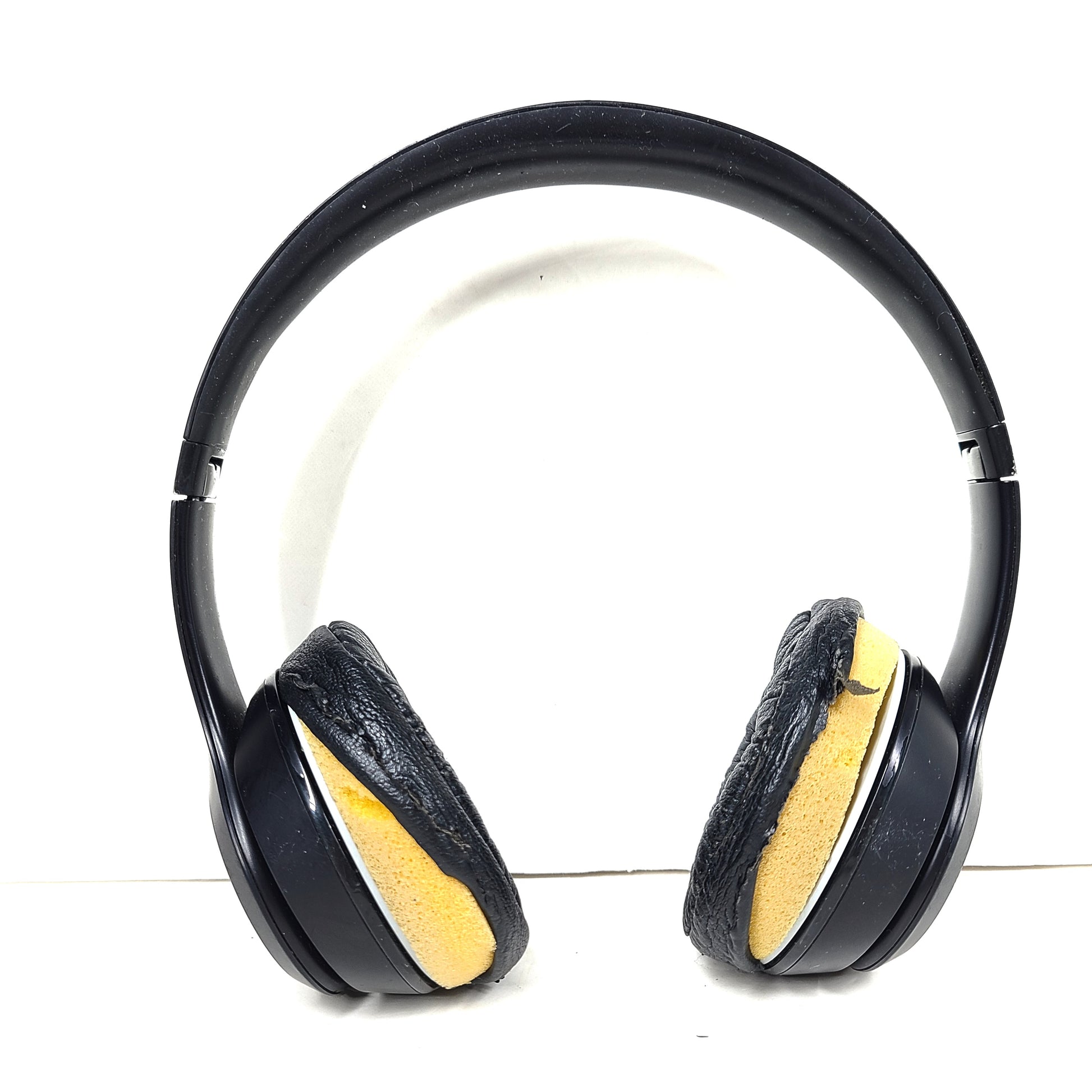Black Beats Solo3 Wireless on-ear headphones with cushioned ear cups and adjustable headband.