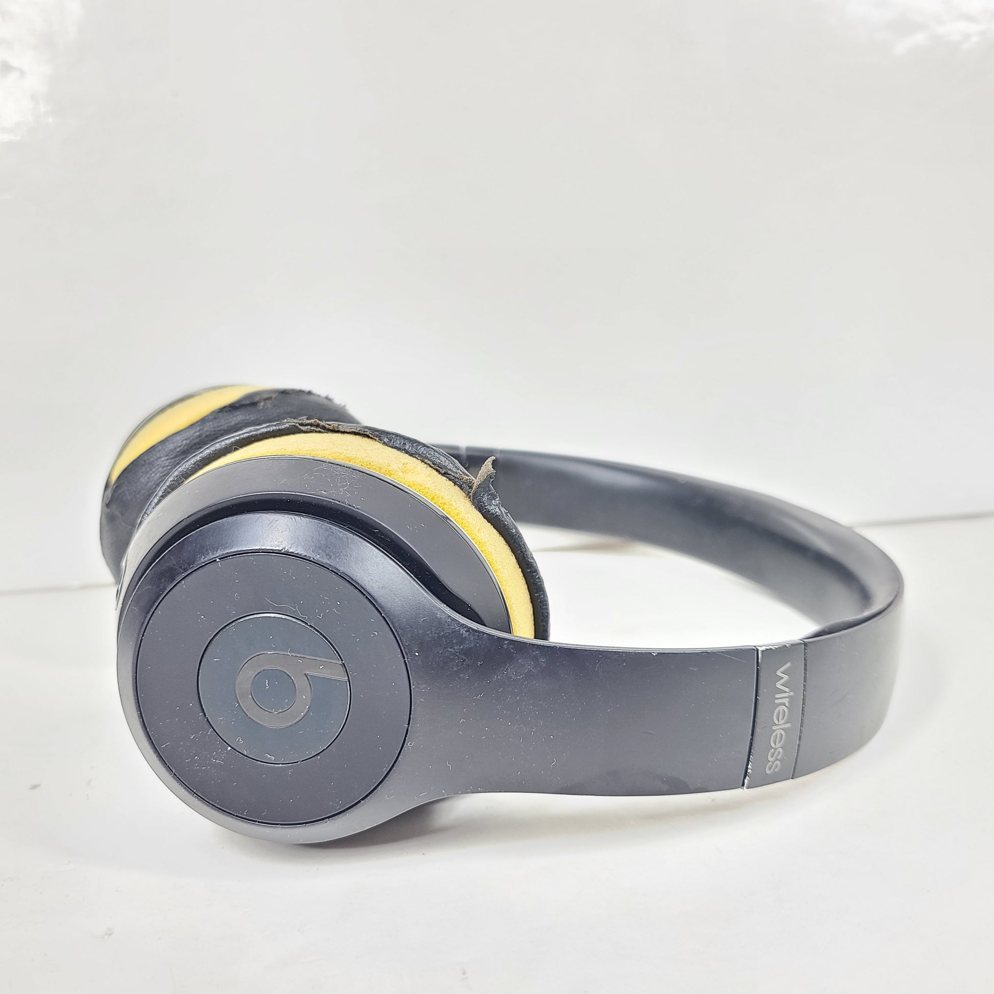 Black Beats Solo3 Wireless on-ear headphones with cushioned ear cups and adjustable headband.