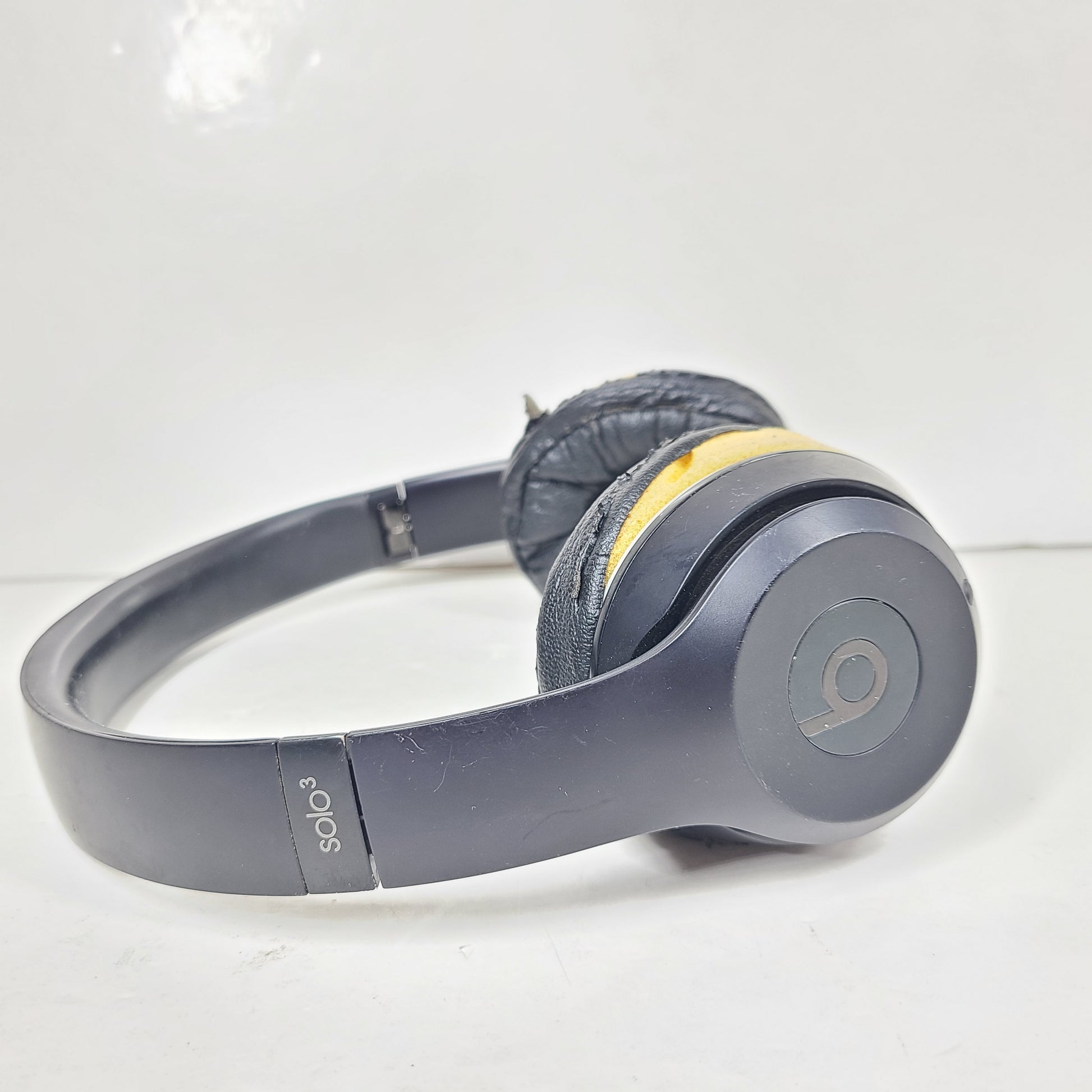 Black Beats Solo3 Wireless on-ear headphones with cushioned ear cups and adjustable headband.