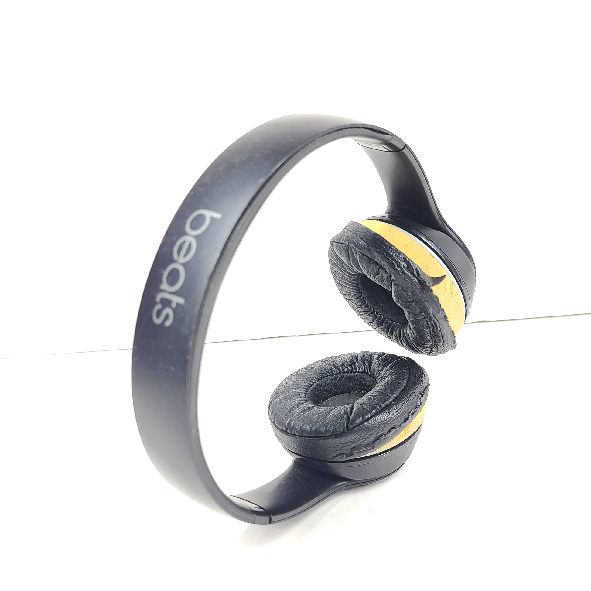 Black Beats Solo3 Wireless on-ear headphones with cushioned ear cups and adjustable headband.