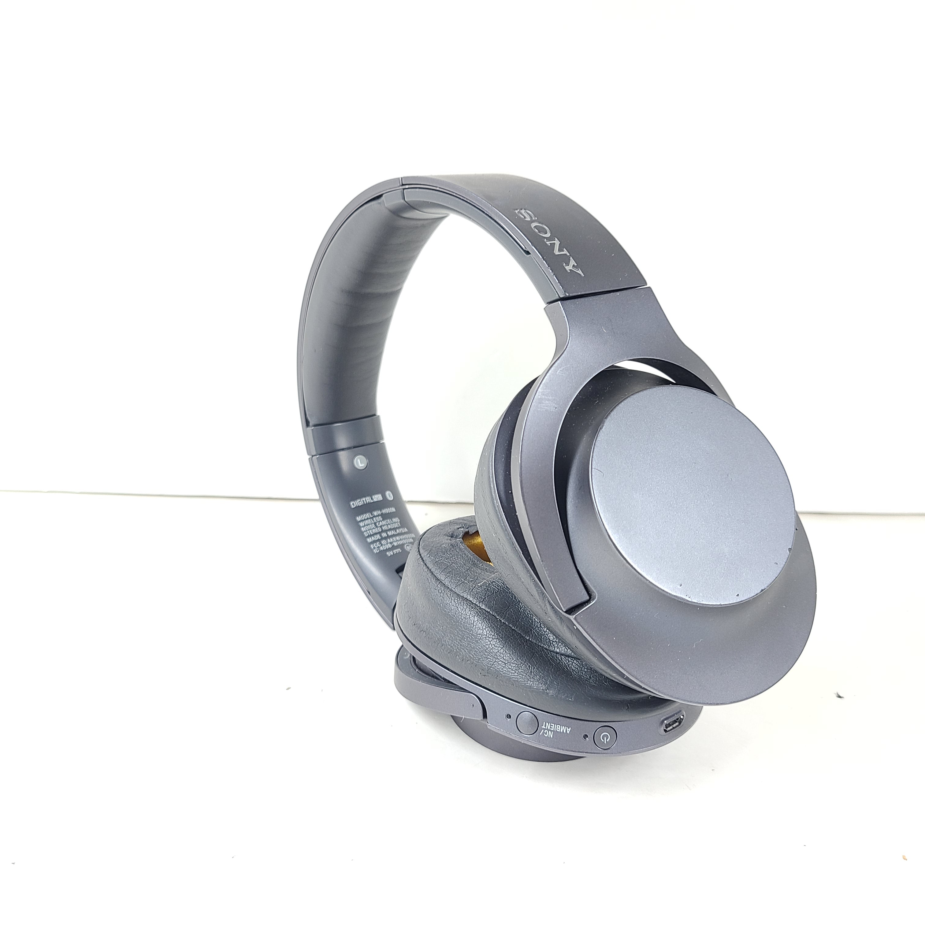 Over-ear Sony WH-H900N wireless headphones in gray with active noise cancellation and Bluetooth connectivity.