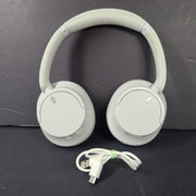 White Sony WH-CH720N over-ear noise-cancelling headphones with adjustable headband and control buttons.