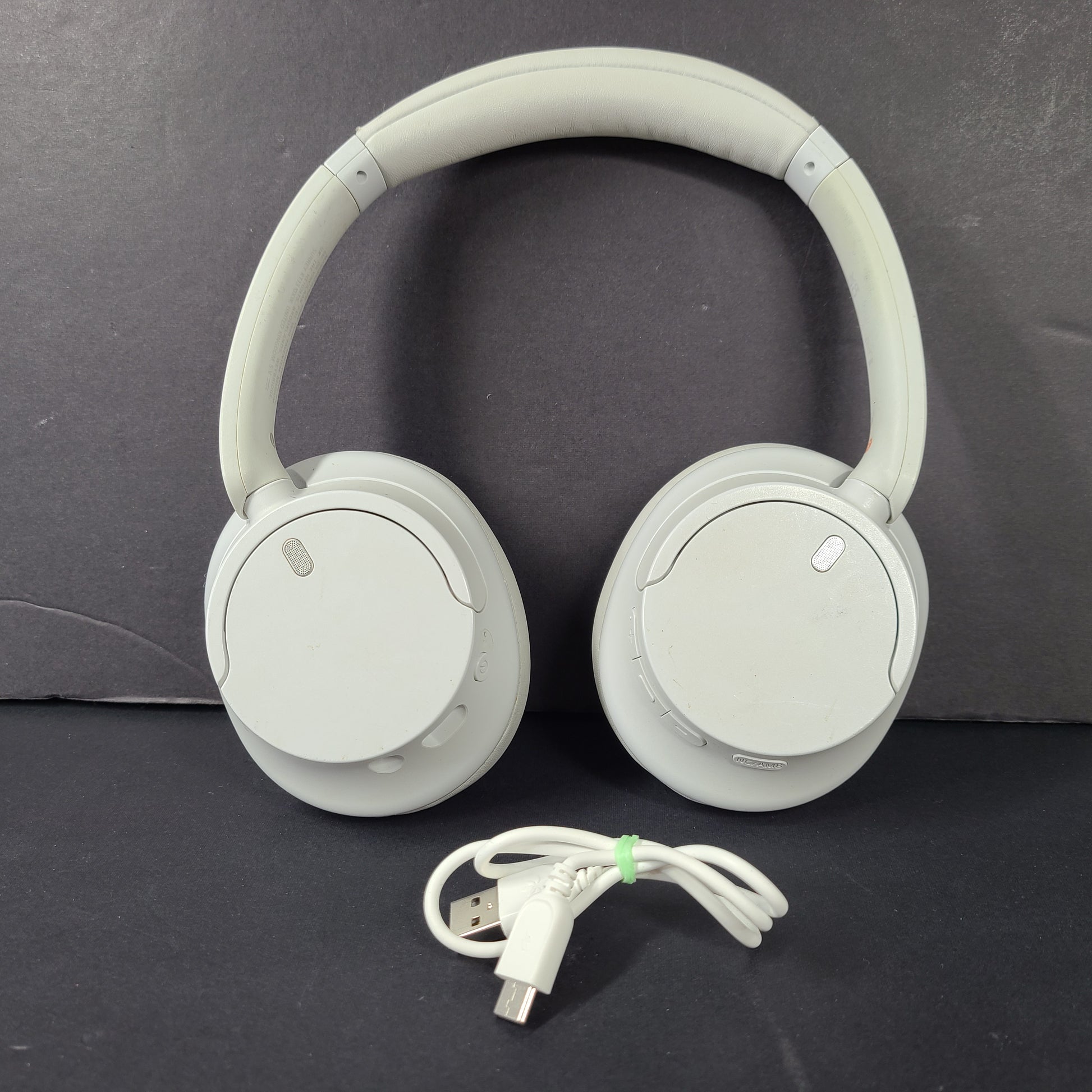 White Sony WH-CH720N over-ear noise-cancelling headphones with adjustable headband and control buttons.