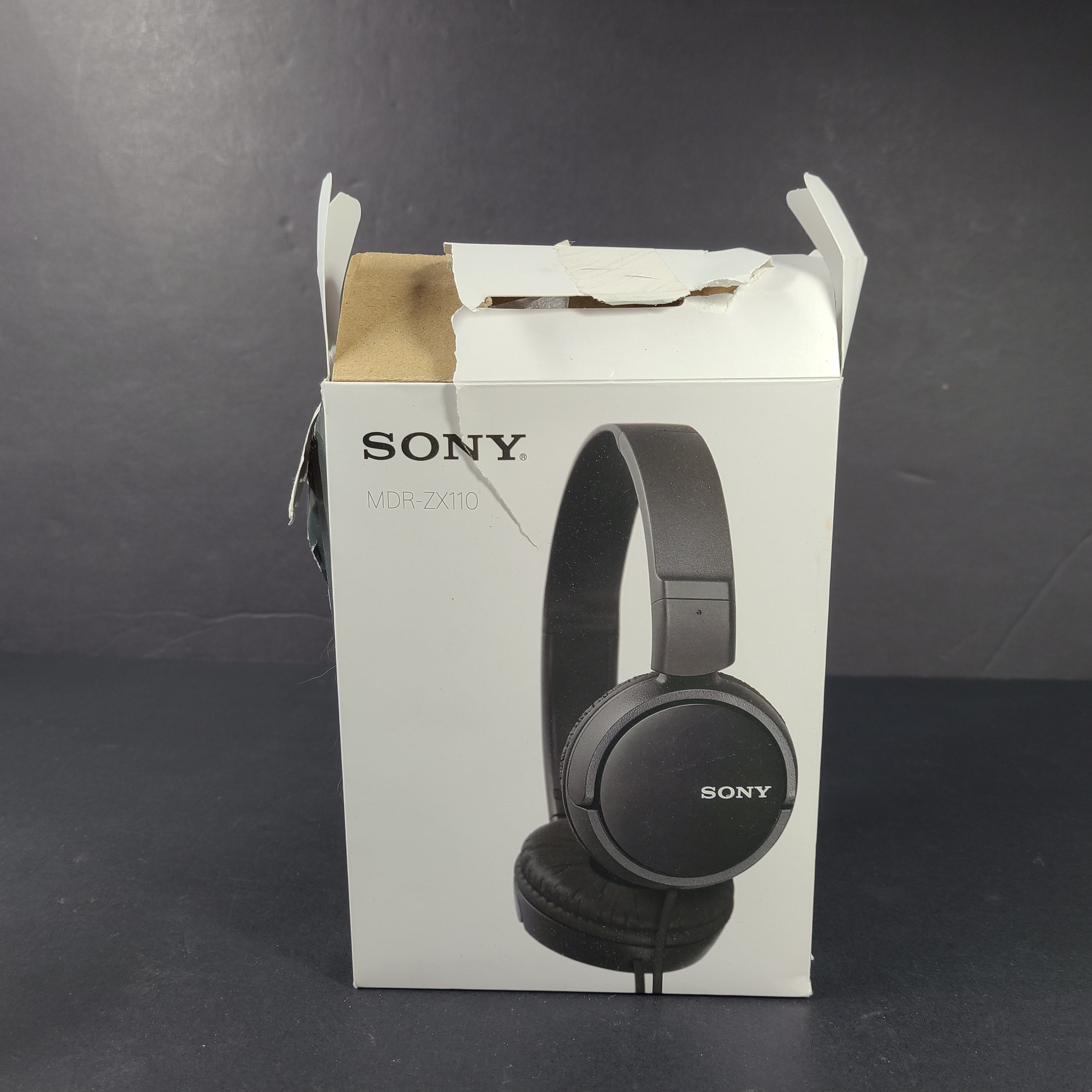 Compact folding black on-ear headphones with 30mm drivers and a serrated tangle-free cable.