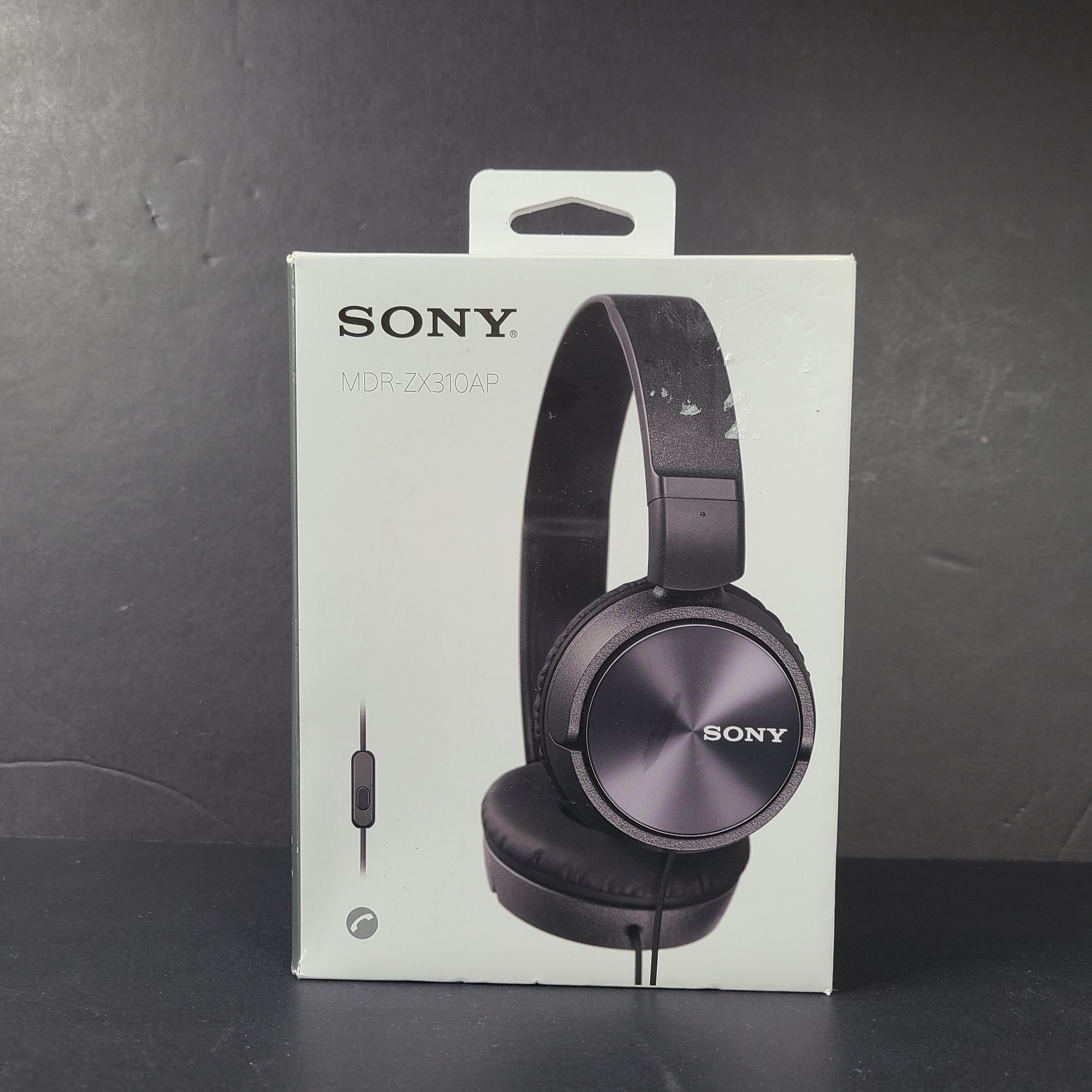 Black Sony MDR-ZX310AP on-ear wired headphones with integrated microphone and 1.2 m cable.