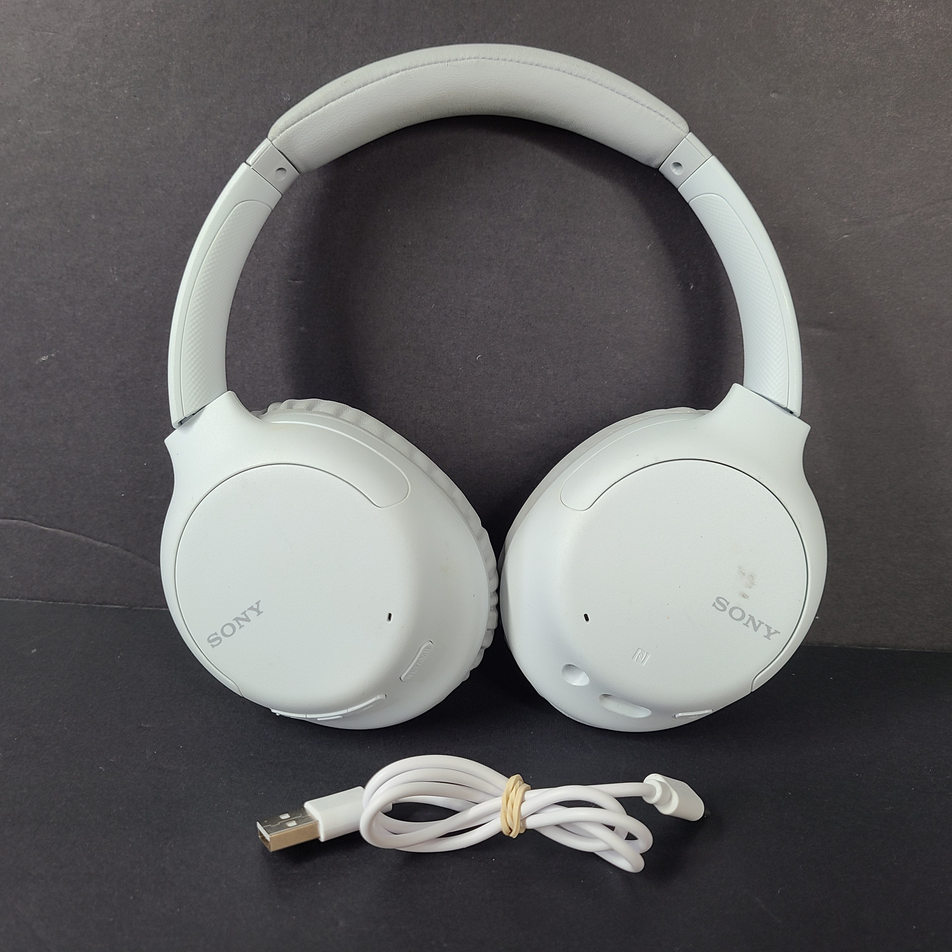 Sony WH-CH710N wireless over-ear headphones in gray with active noise cancellation and cushioned earcups.