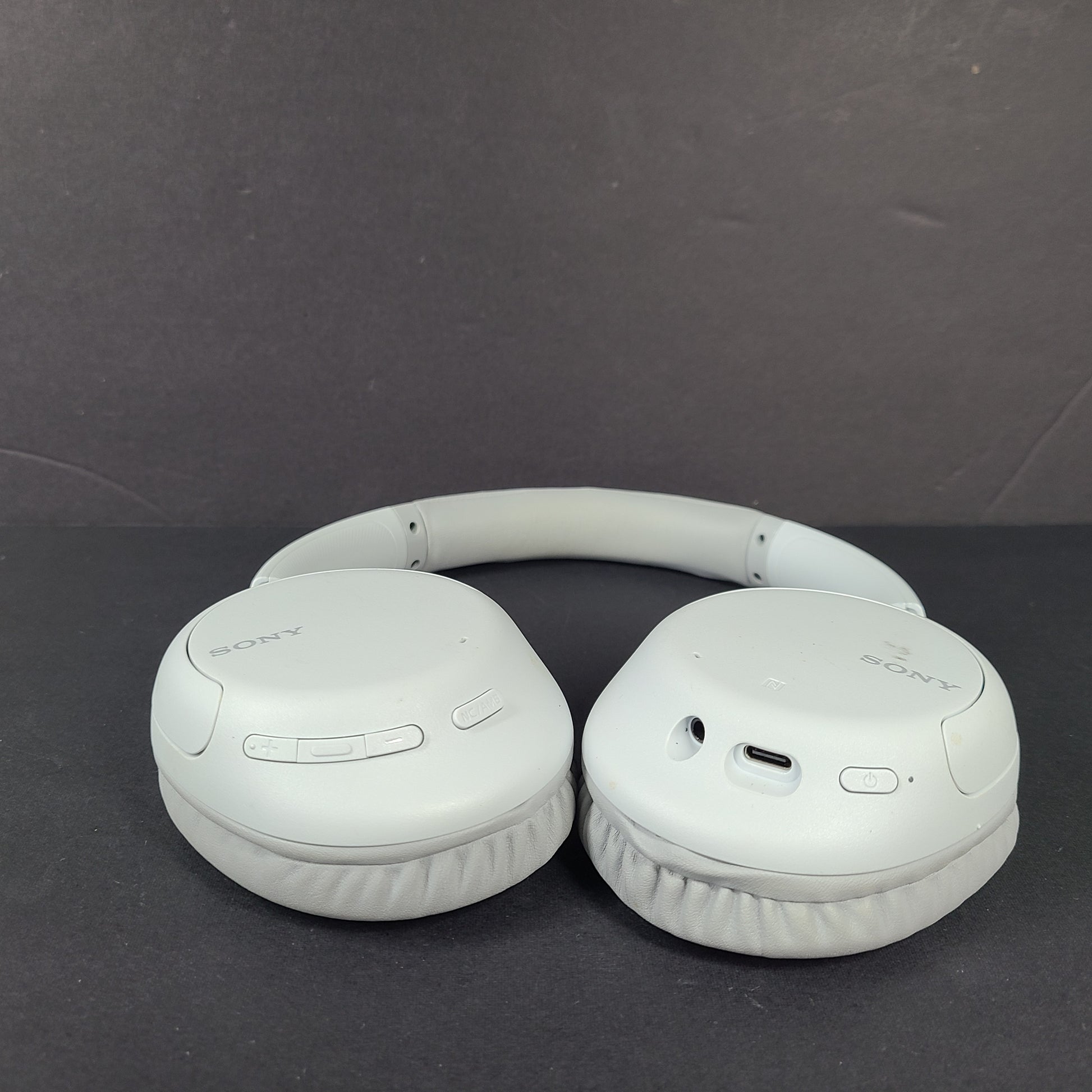 Sony WH-CH710N wireless over-ear headphones in gray with active noise cancellation and cushioned earcups.