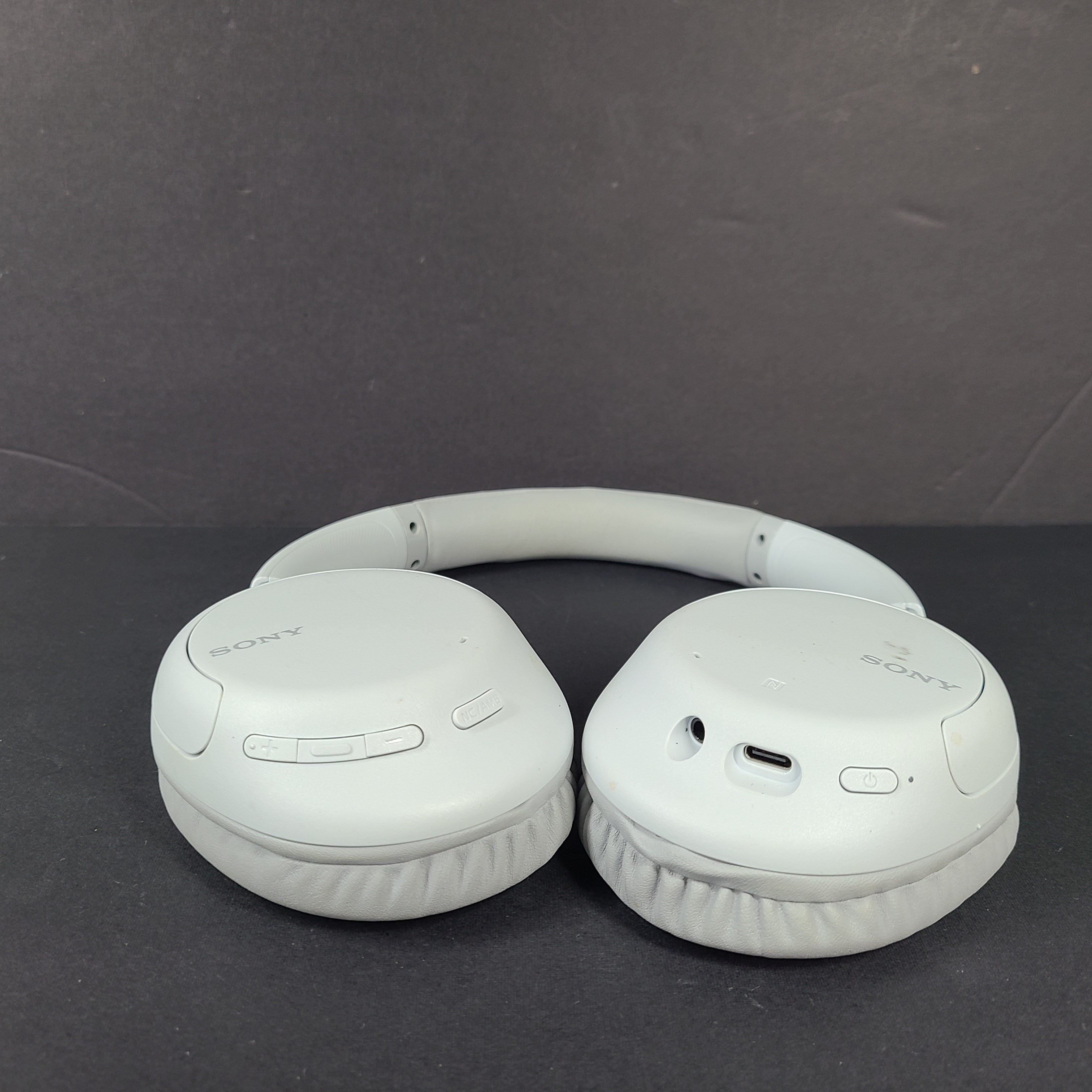 Sony WH-CH710N wireless over-ear headphones in gray with active noise cancellation and cushioned earcups.