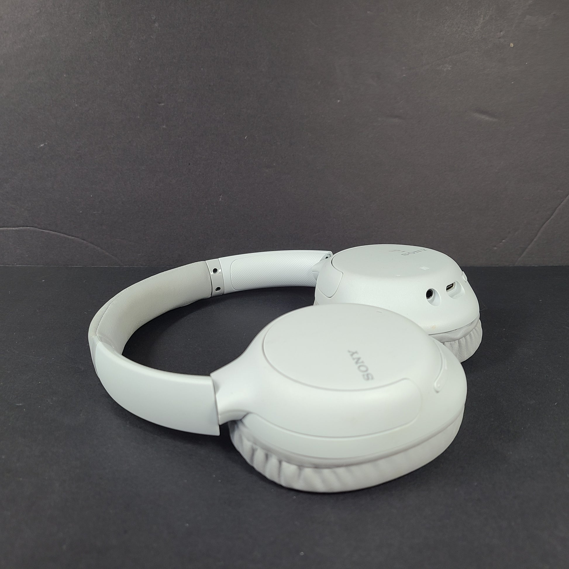 Sony WH-CH710N wireless over-ear headphones in gray with active noise cancellation and cushioned earcups.