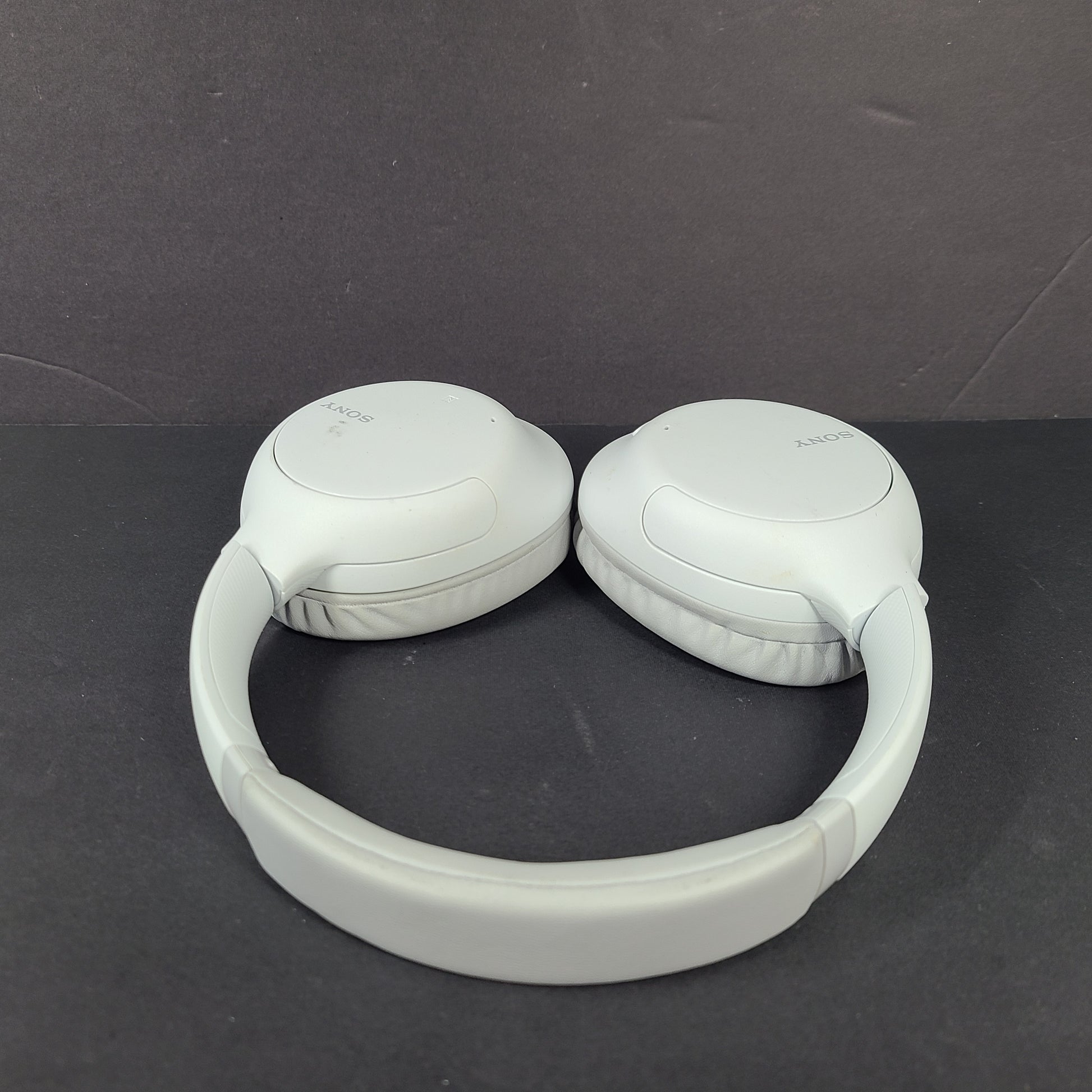 Sony WH-CH710N wireless over-ear headphones in gray with active noise cancellation and cushioned earcups.