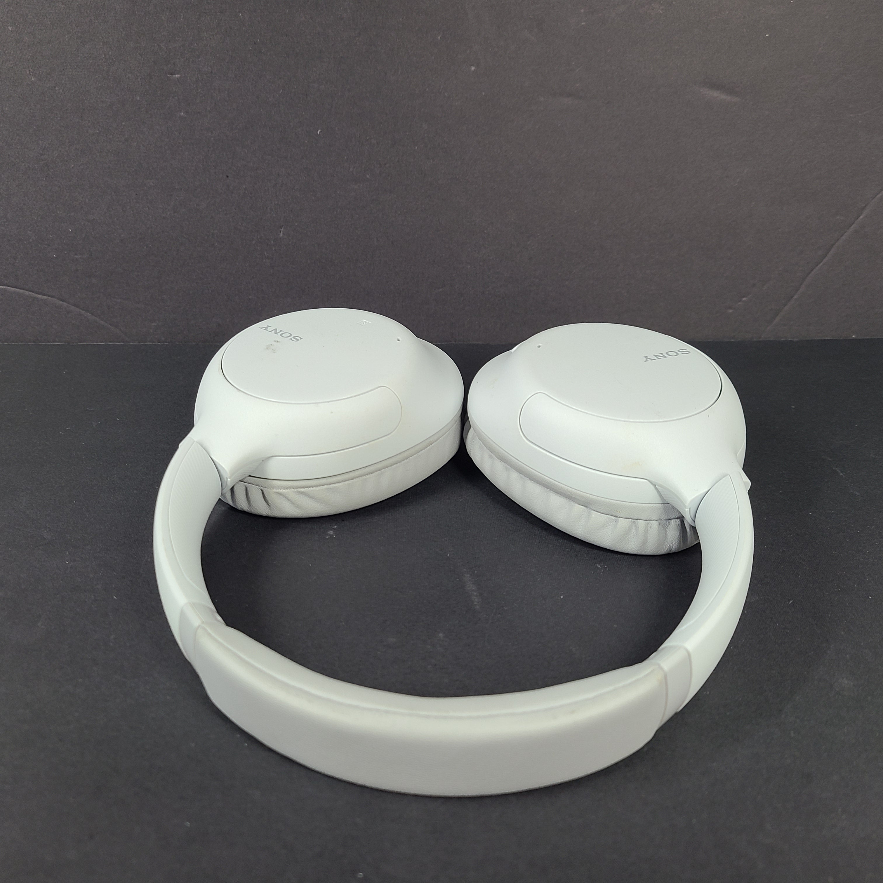 Sony WH-CH710N wireless over-ear headphones in gray with active noise cancellation and cushioned earcups.