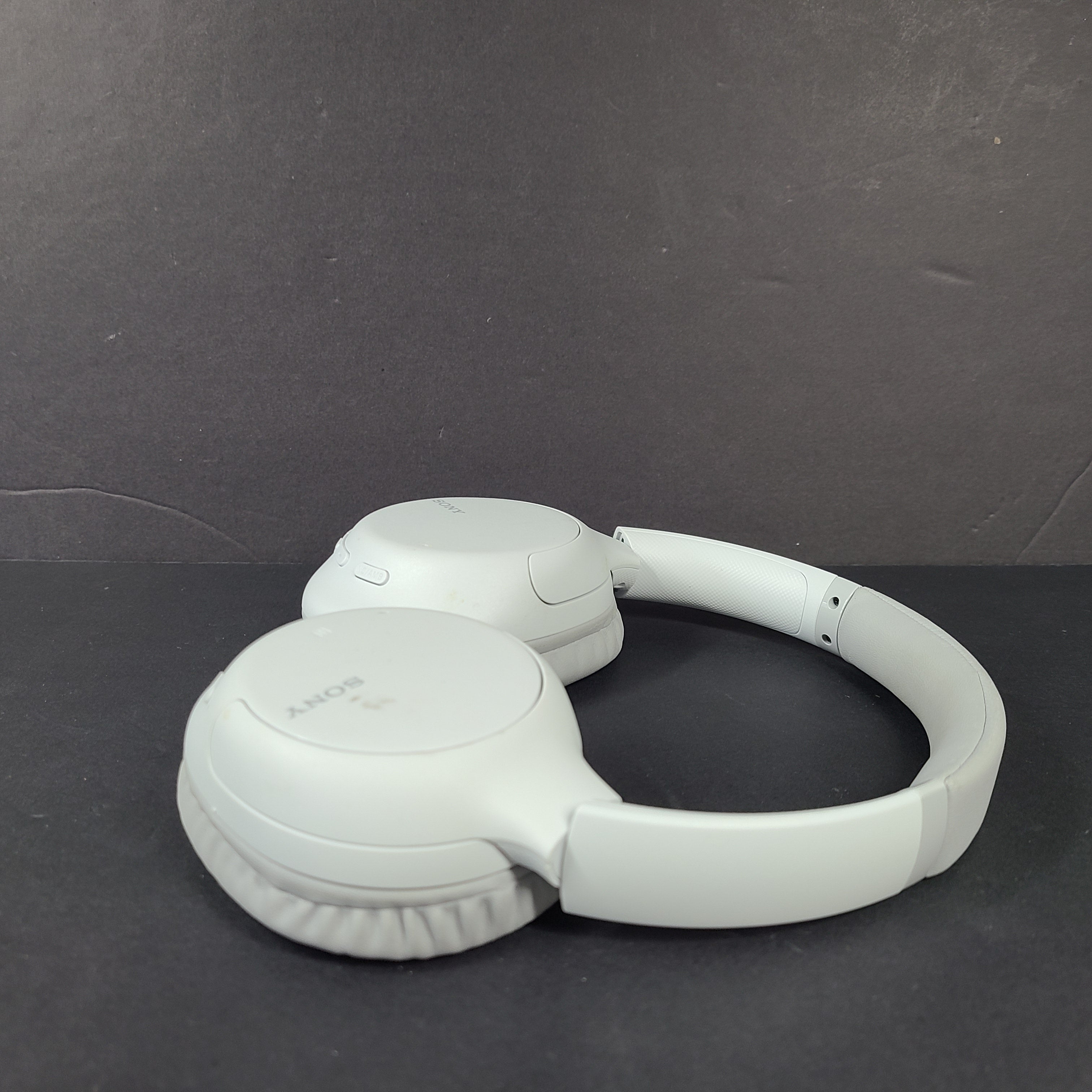 Sony WH-CH710N wireless over-ear headphones in gray with active noise cancellation and cushioned earcups.