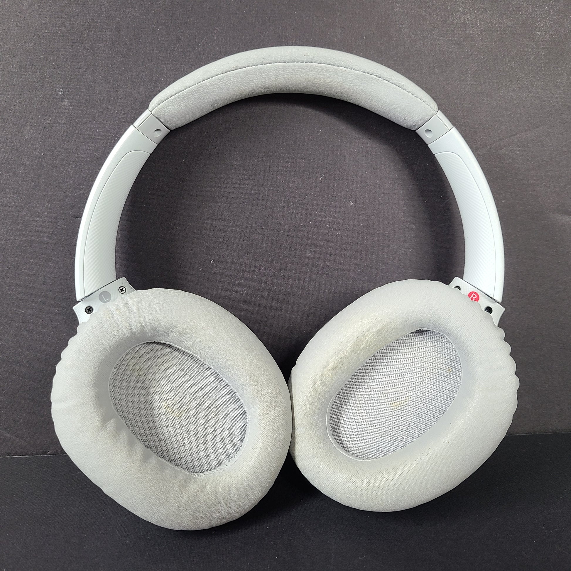 Sony WH-CH710N wireless over-ear headphones in gray with active noise cancellation and cushioned earcups.