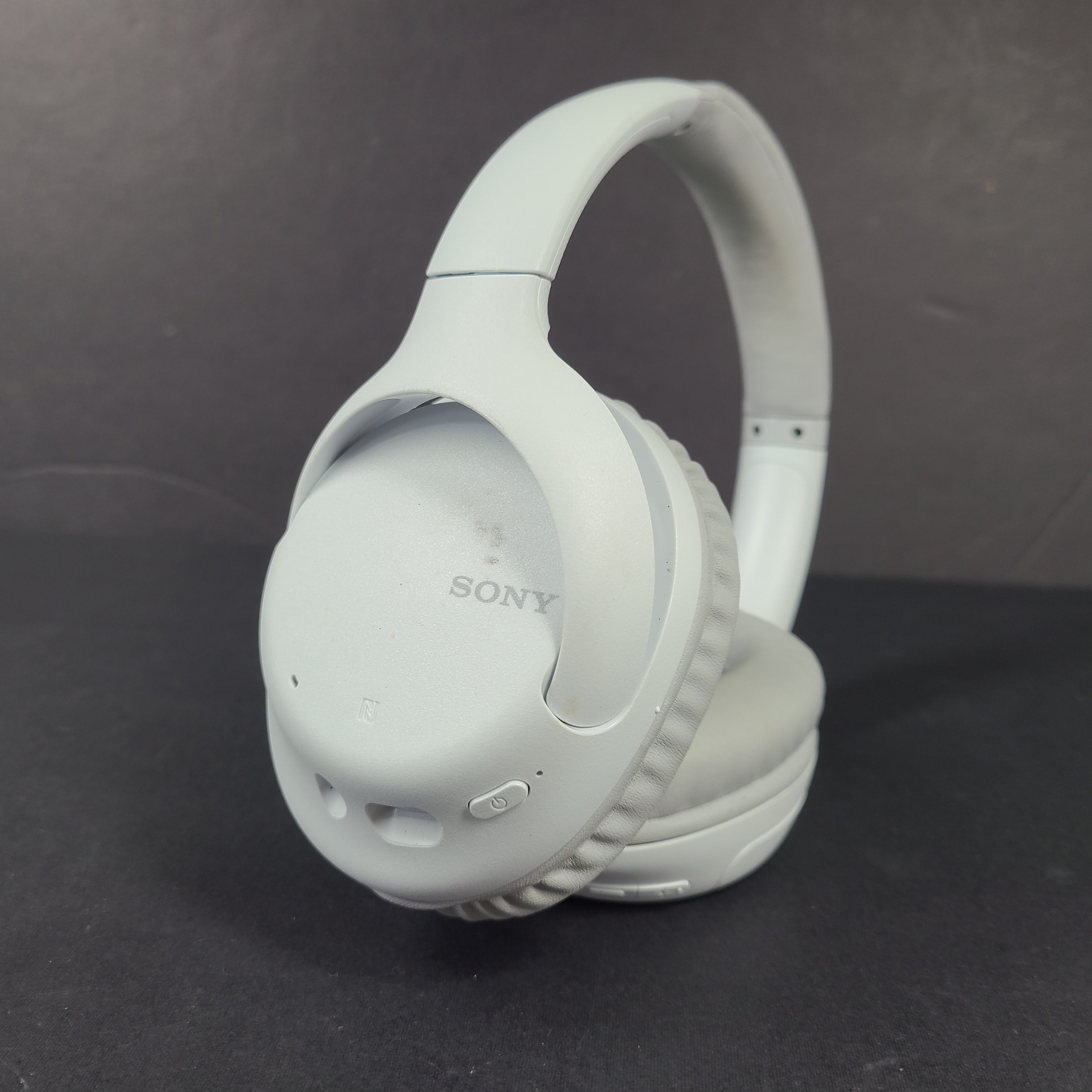 Sony WH-CH710N wireless over-ear headphones in gray with active noise cancellation and cushioned earcups.