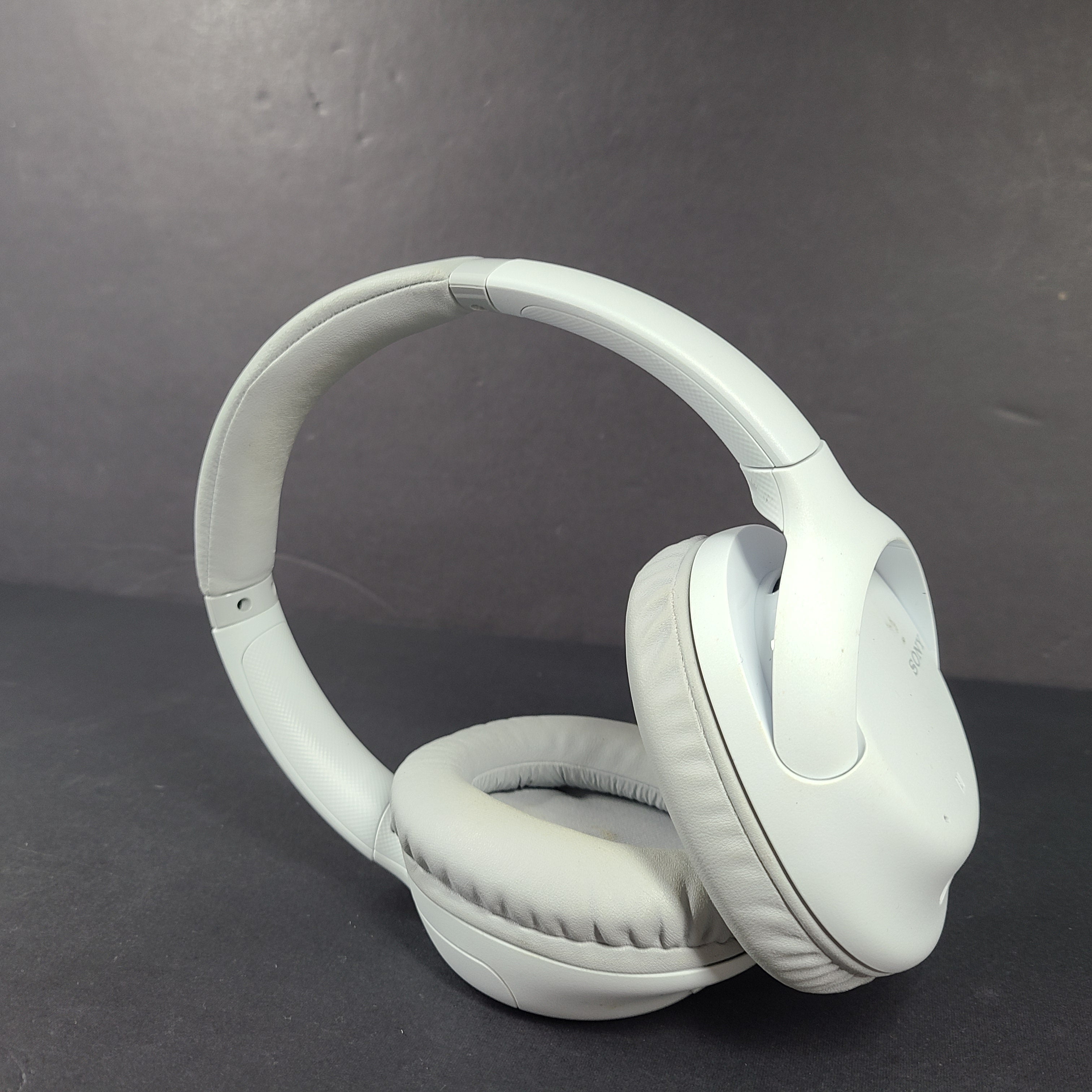 Sony WH-CH710N wireless over-ear headphones in gray with active noise cancellation and cushioned earcups.