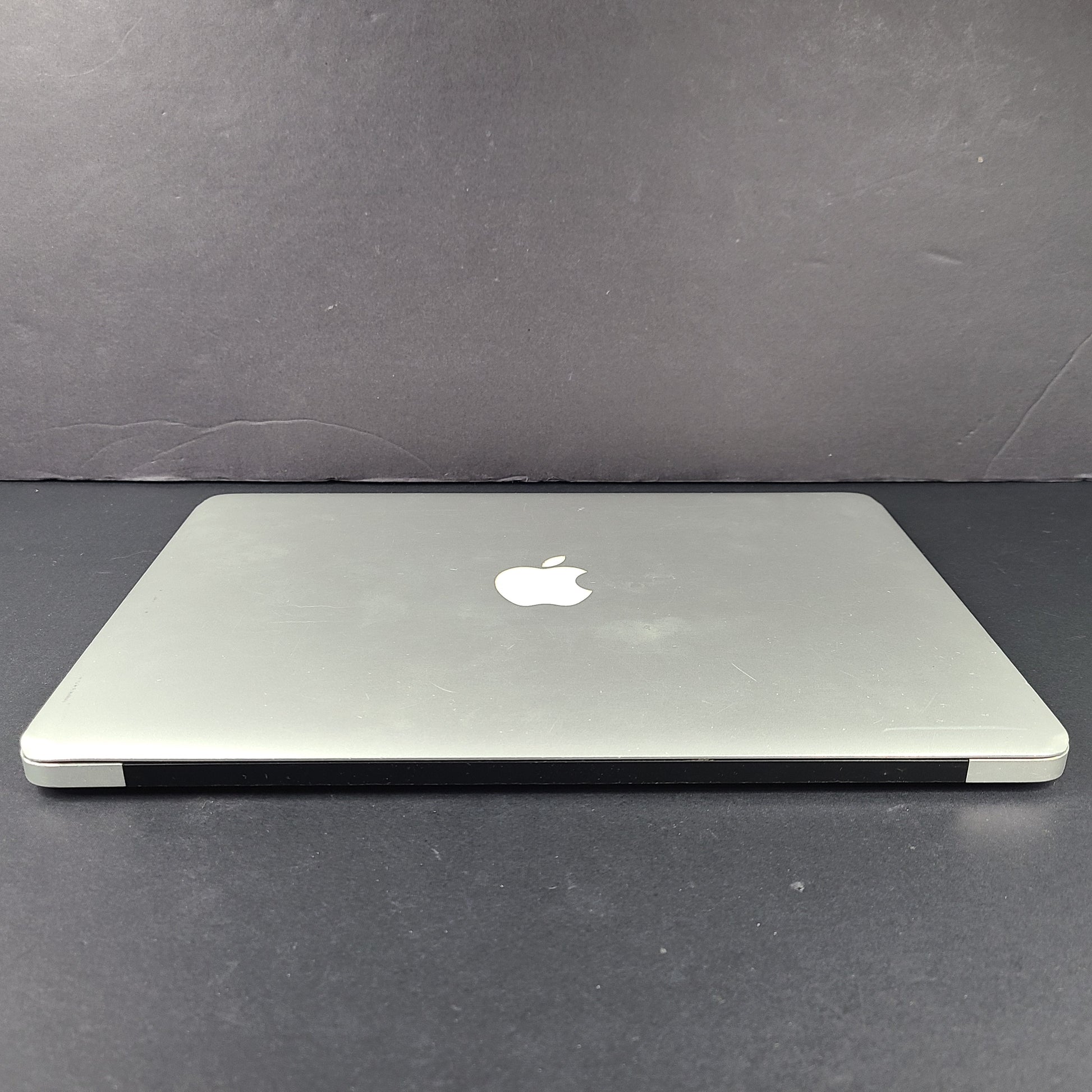 Silver Apple MacBook Air A1466 with body wear and a damaged screen, sold with a charger.