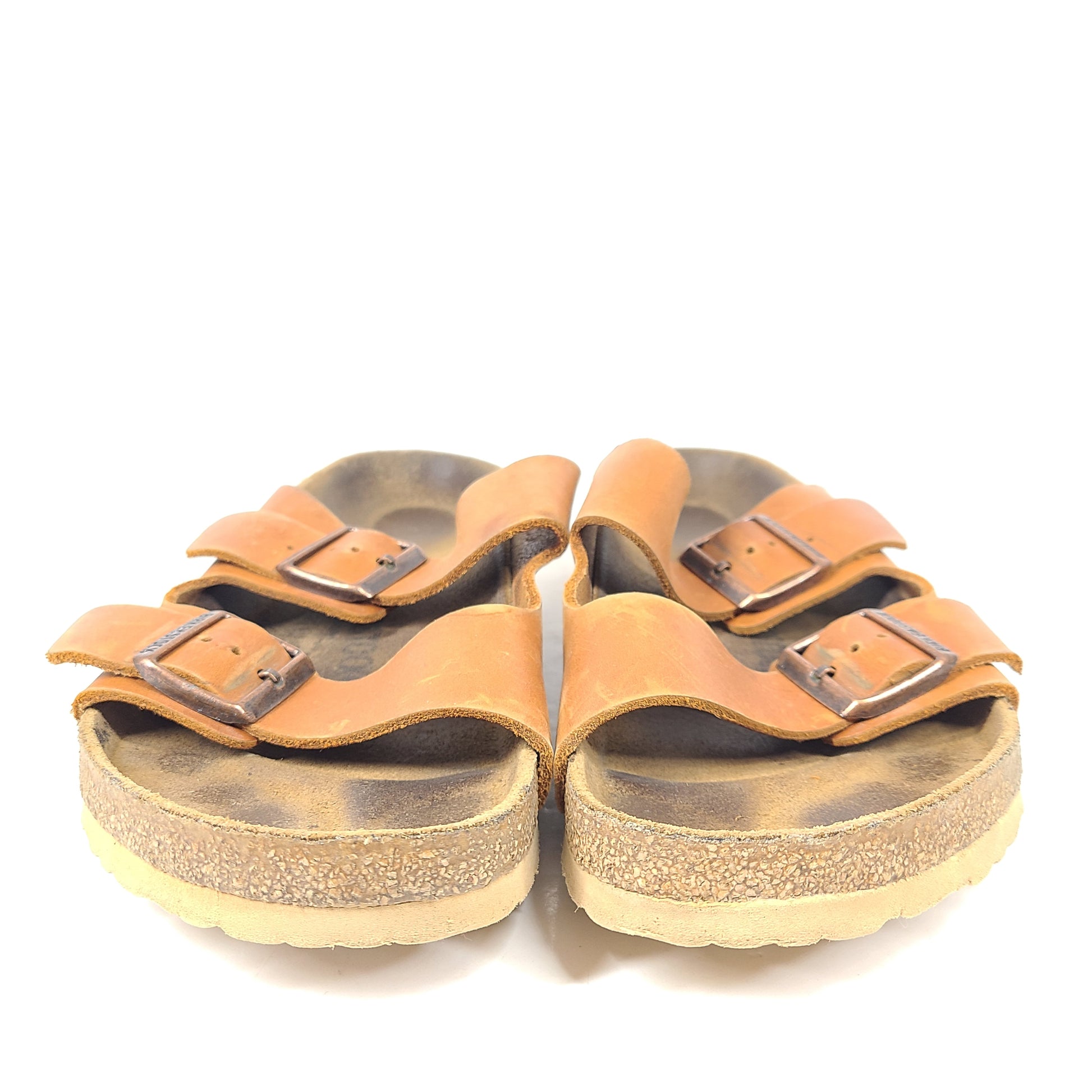 Brown Birkenstock sandals in EU size 42, model 278 with an imprint on the footbed and mild wear on straps and footbeds.