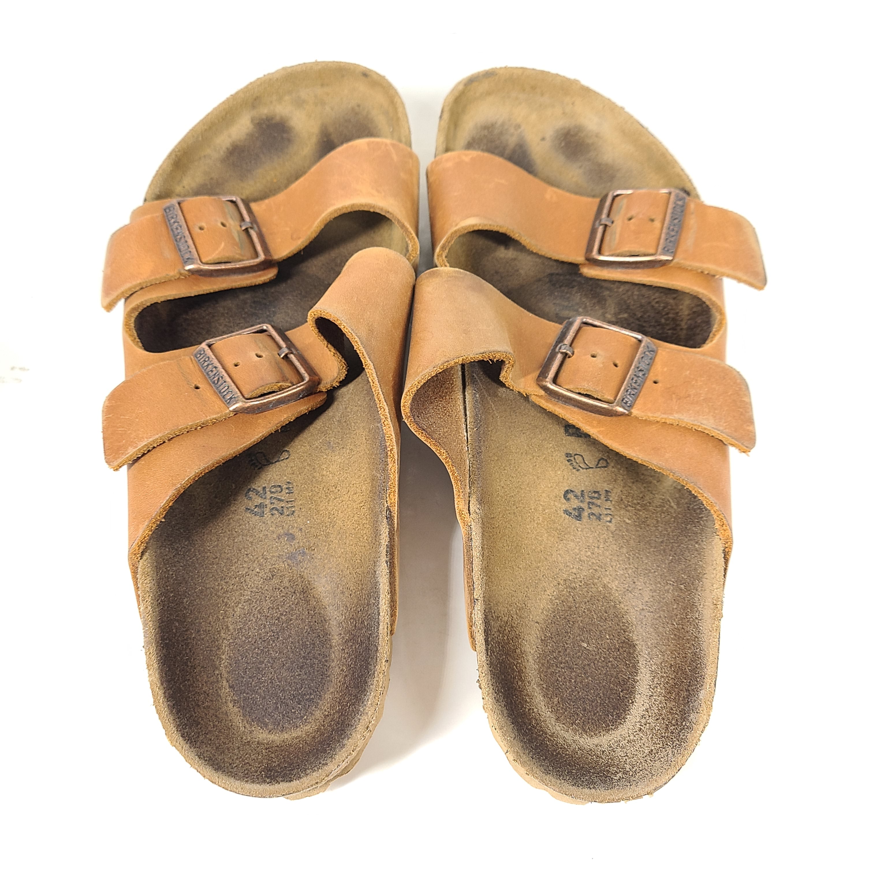 Brown Birkenstock sandals in EU size 42, model 278 with an imprint on the footbed and mild wear on straps and footbeds.