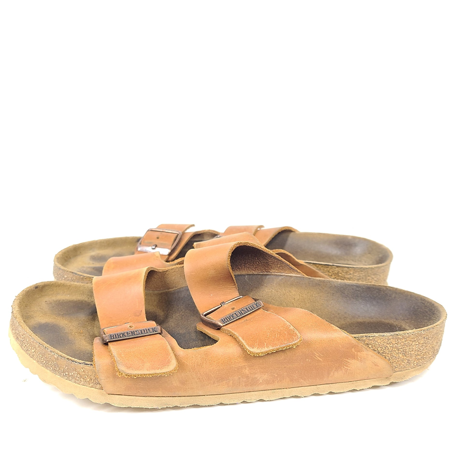 Brown Birkenstock sandals in EU size 42, model 278 with an imprint on the footbed and mild wear on straps and footbeds.