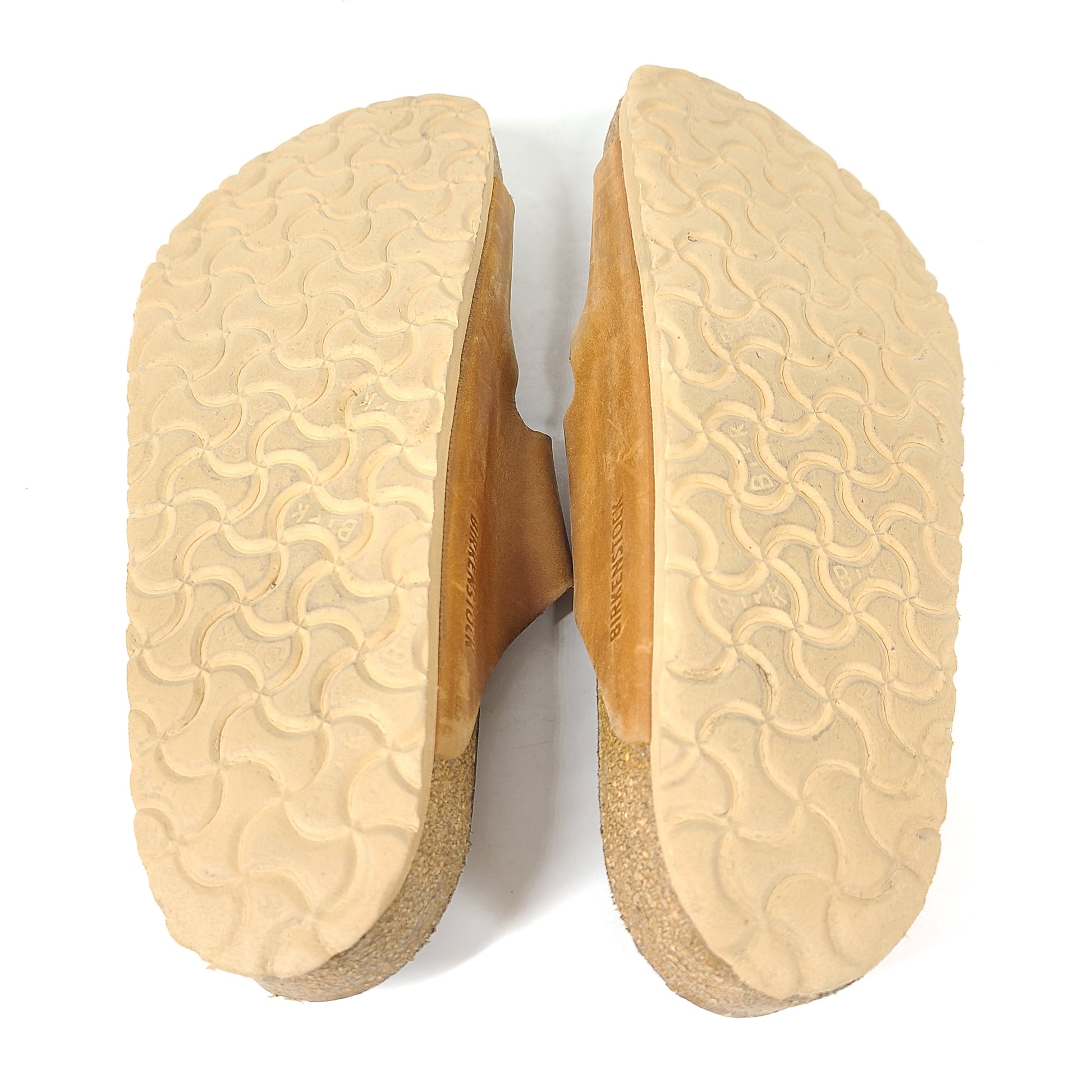 Brown Birkenstock sandals in EU size 42, model 278 with an imprint on the footbed and mild wear on straps and footbeds.