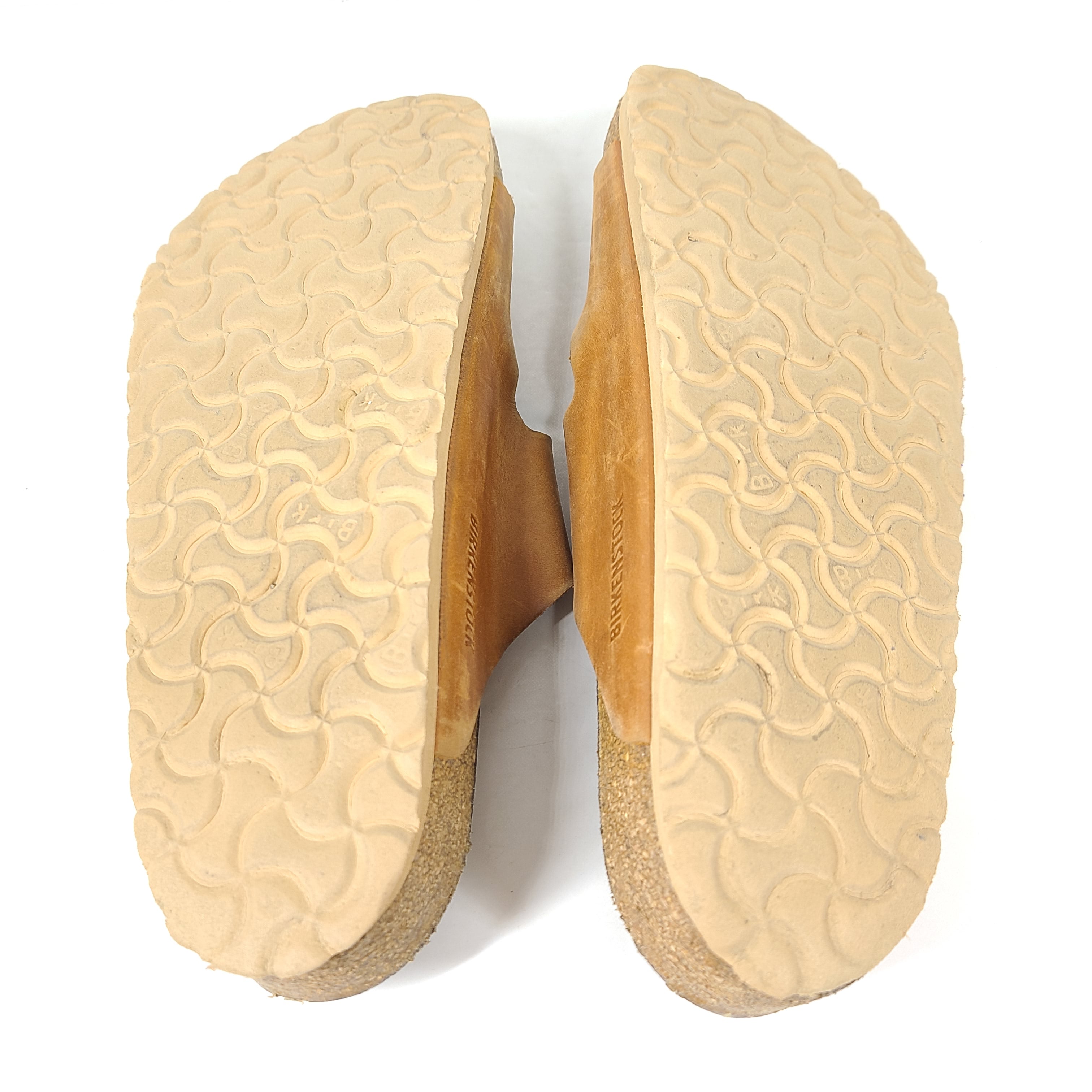 Brown Birkenstock sandals in EU size 42, model 278 with an imprint on the footbed and mild wear on straps and footbeds.