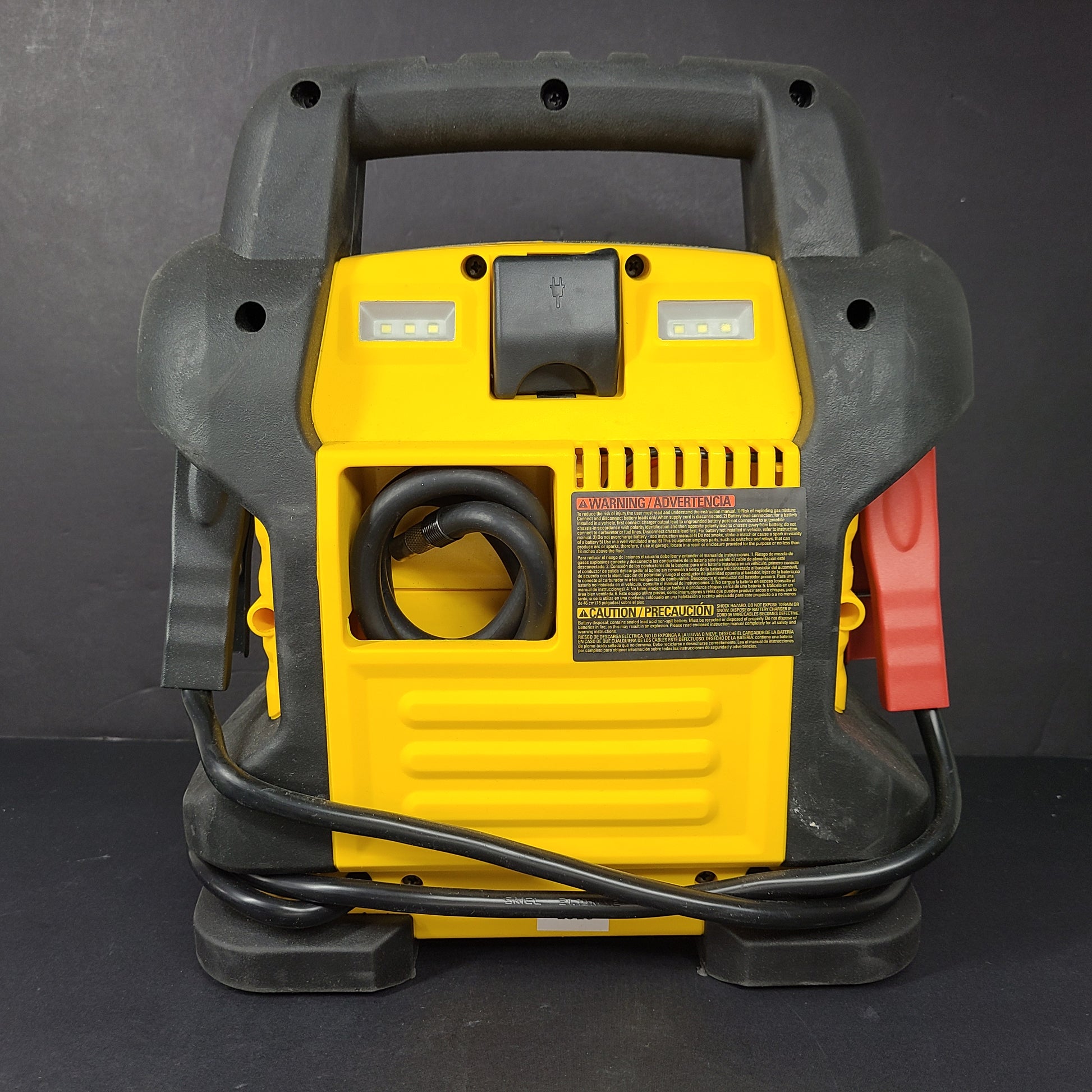 DeWalt DXAEJ14 portable jump starter and air compressor in black and yellow with heavy-duty clamps and USB power.