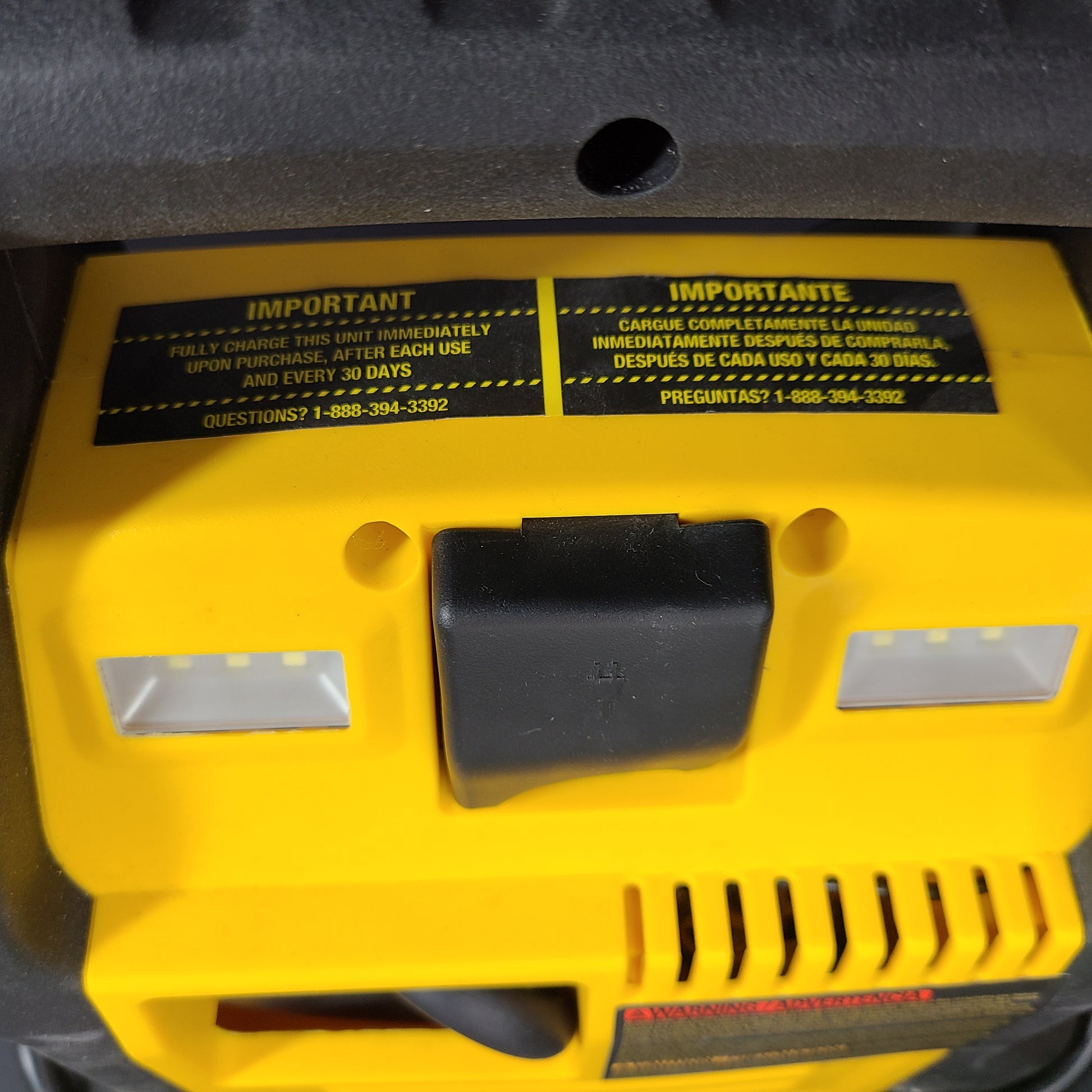 DeWalt DXAEJ14 portable jump starter and air compressor in black and yellow with heavy-duty clamps and USB power.