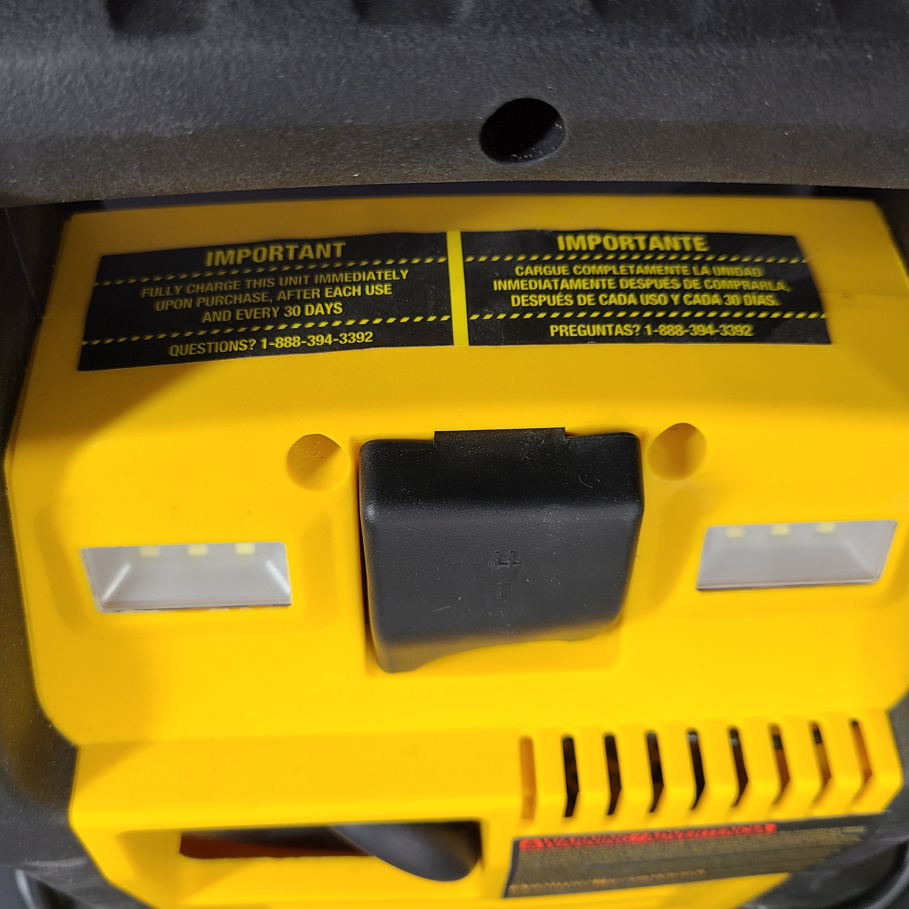 DeWalt DXAEJ14 portable jump starter and air compressor in black and yellow with heavy-duty clamps and USB power.