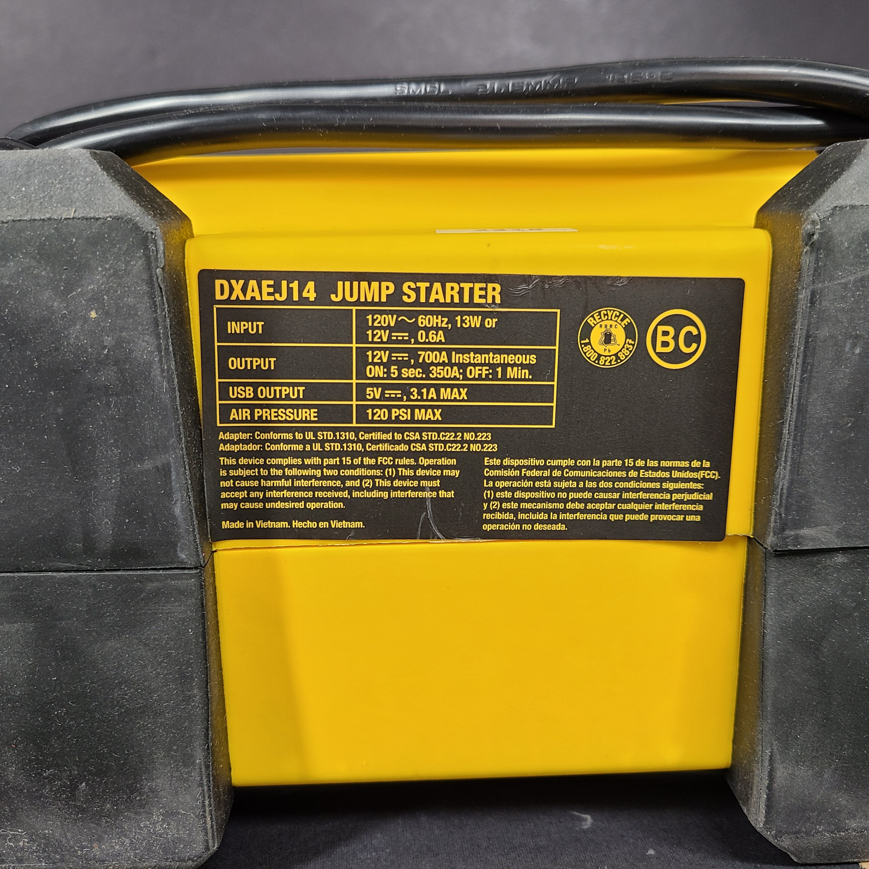 DeWalt DXAEJ14 portable jump starter and air compressor in black and yellow with heavy-duty clamps and USB power.