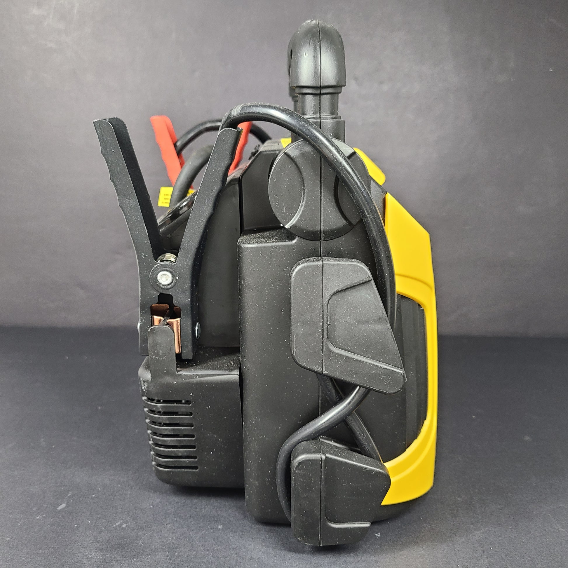 Yellow and black EverStart Maxx jump starter with built-in jumper cables and an integrated air compressor for portable vehicle power and inflation.