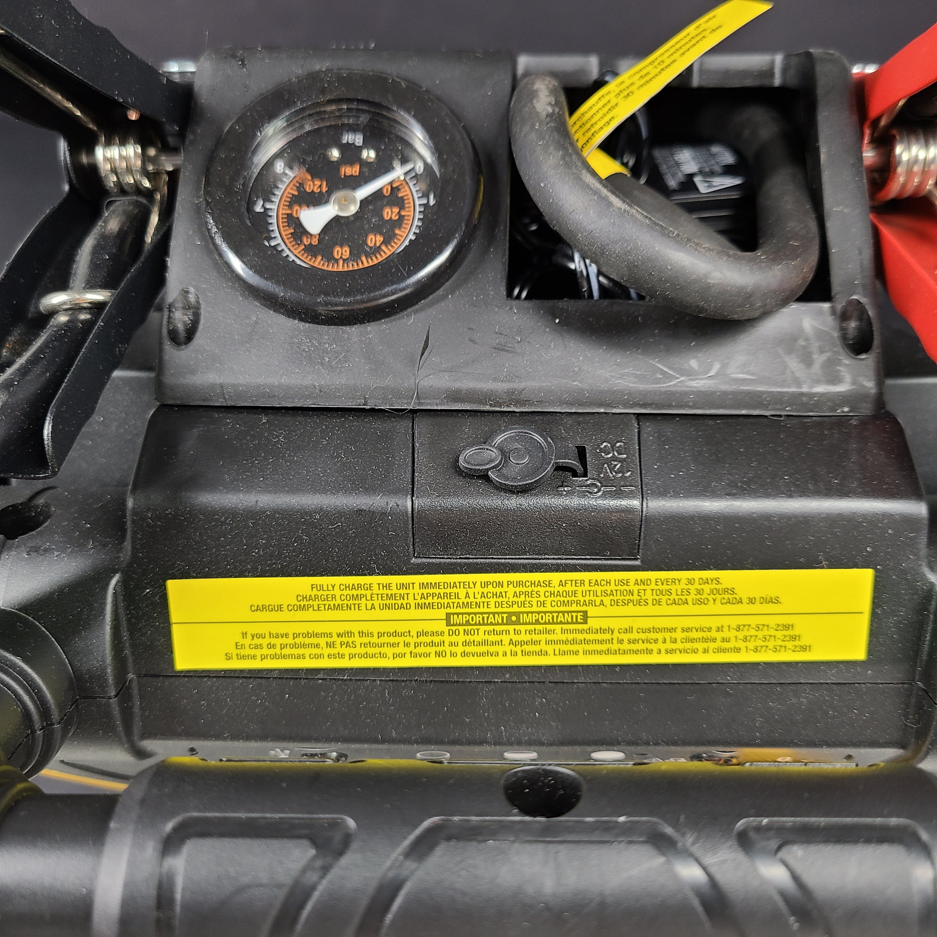 Yellow and black EverStart Maxx jump starter with built-in jumper cables and an integrated air compressor for portable vehicle power and inflation.