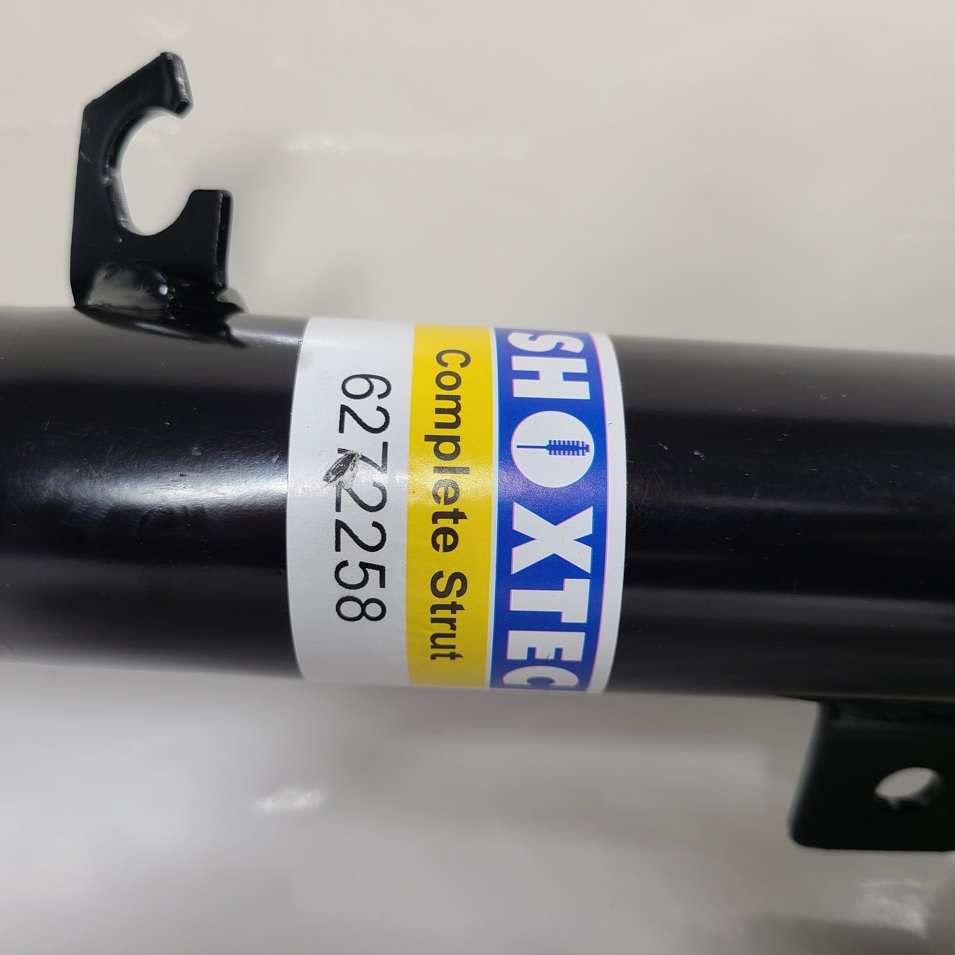 Two Shoxtec Complete Struts in black with mounting accessories for vehicle suspension replacement.