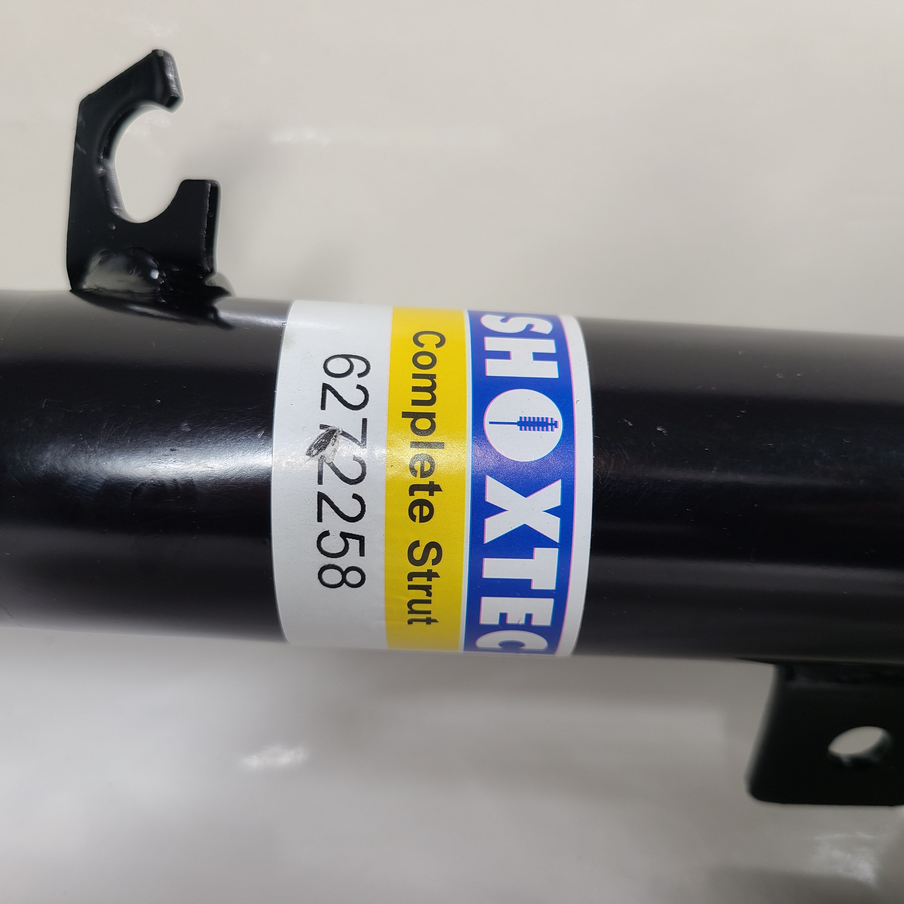 Two Shoxtec Complete Struts in black with mounting accessories for vehicle suspension replacement.