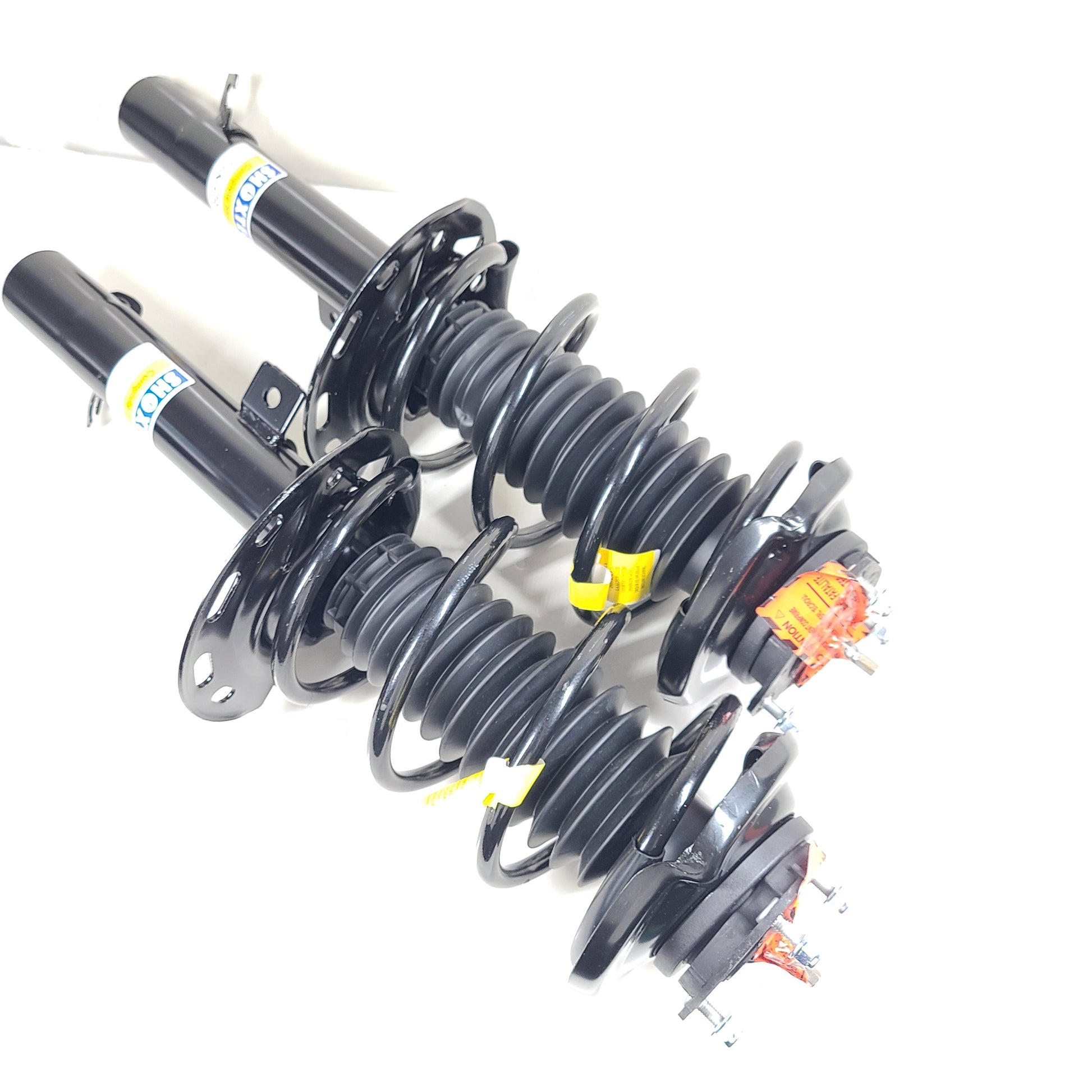 Two Shoxtec Complete Struts in black with mounting accessories for vehicle suspension replacement.