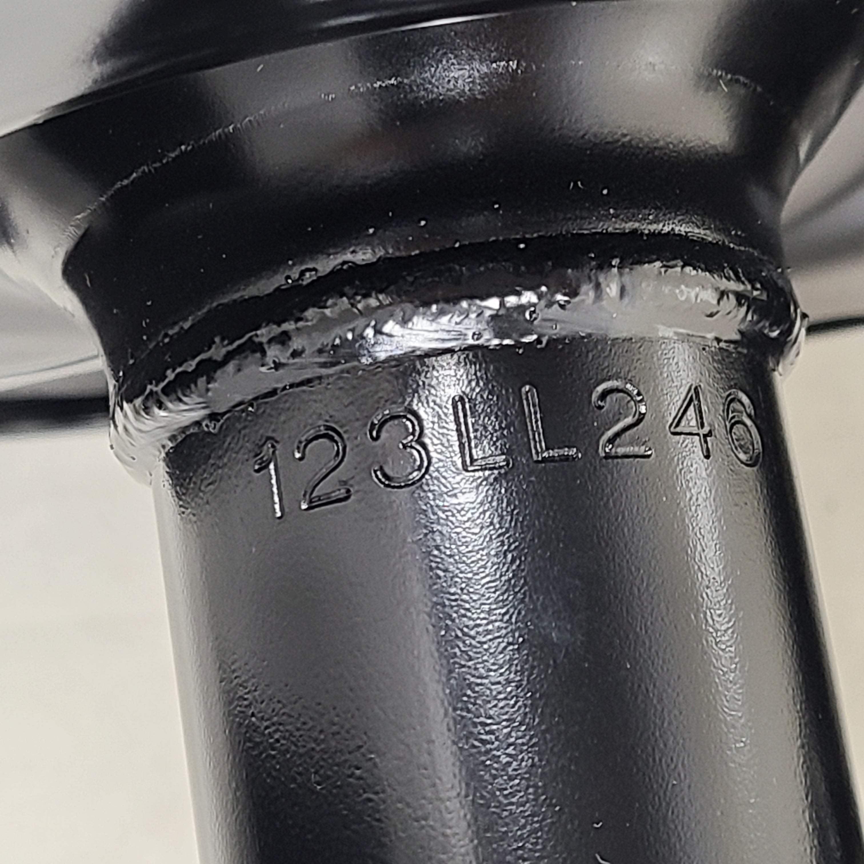 Unity black suspension strut assembly for models 123LL246 and 124CL245, intended for vehicle suspension replacement.