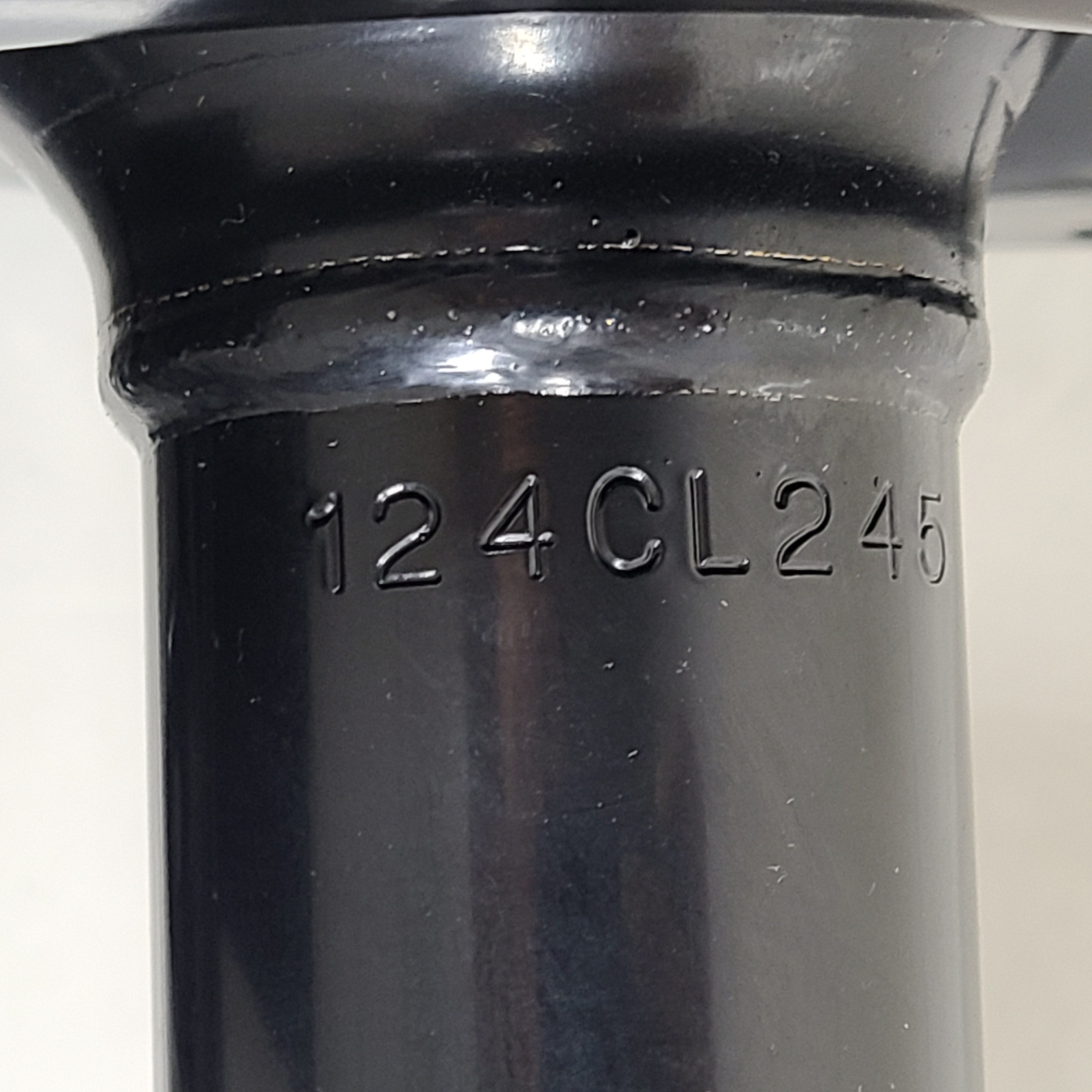 Unity black suspension strut assembly for models 123LL246 and 124CL245, intended for vehicle suspension replacement.
