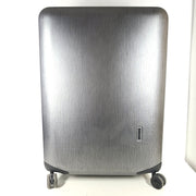 Black Samsonite Spinner 81/30 suitcase with scuffing on wheels and a clean interior.