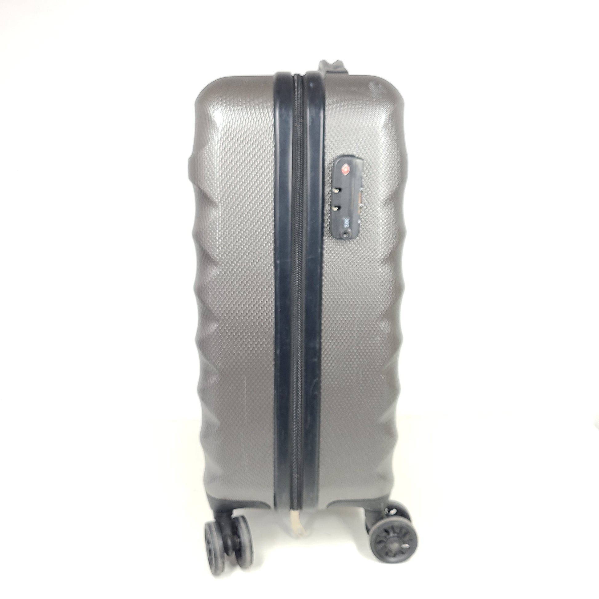 Gray ESPACE carry-on luggage constructed from polyethylene vinyl acetate with scuffs and an intact interior.