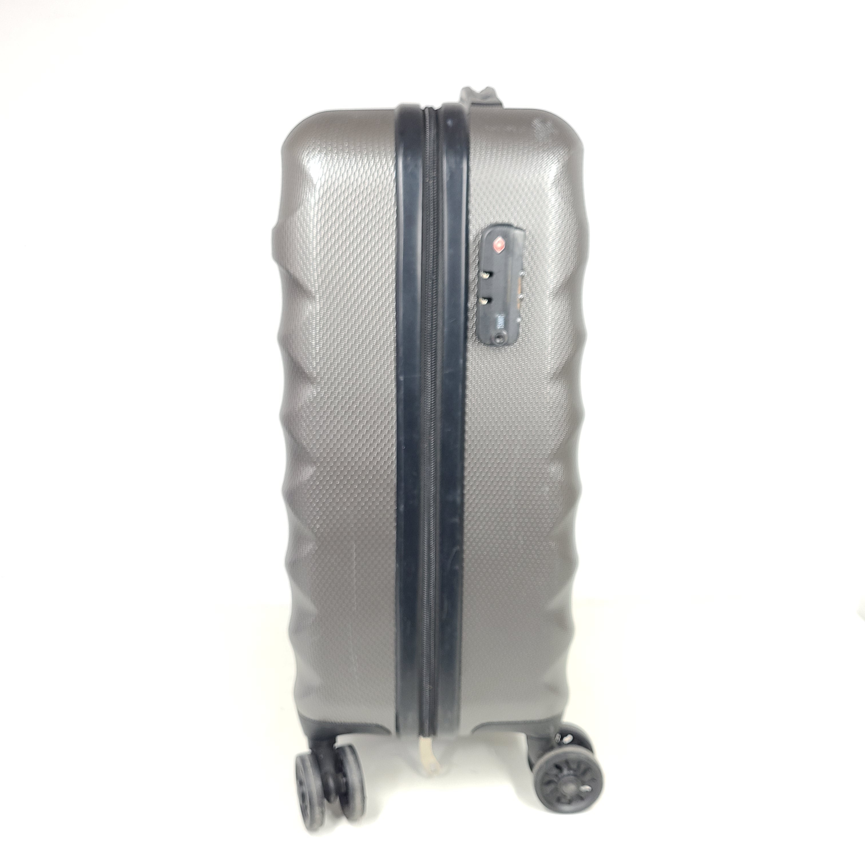 Gray ESPACE carry-on luggage constructed from polyethylene vinyl acetate with scuffs and an intact interior.