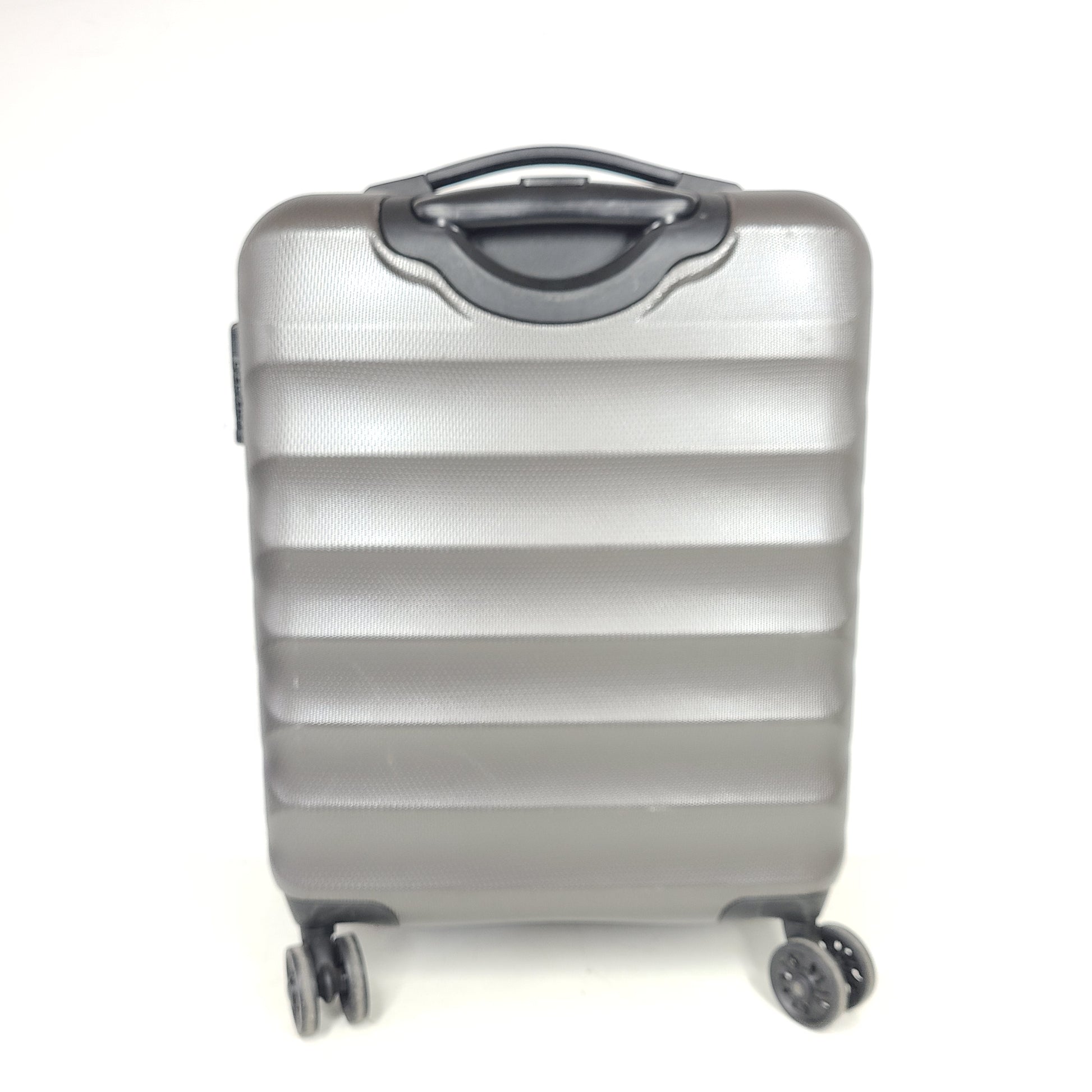 Gray ESPACE carry-on luggage constructed from polyethylene vinyl acetate with scuffs and an intact interior.