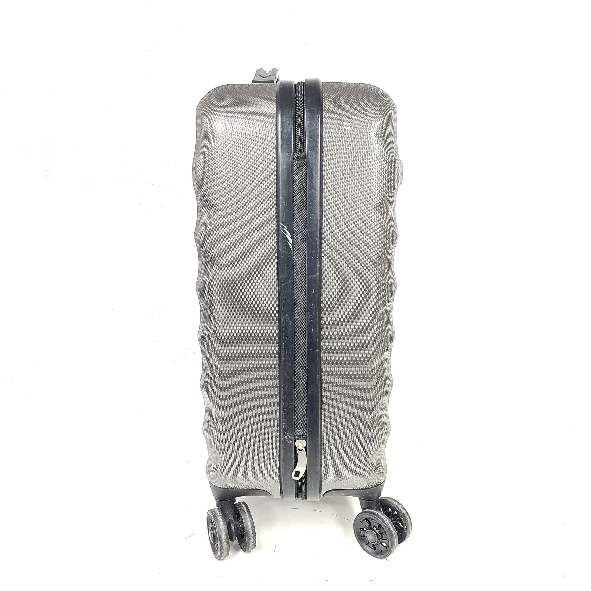 Gray ESPACE carry-on luggage constructed from polyethylene vinyl acetate with scuffs and an intact interior.