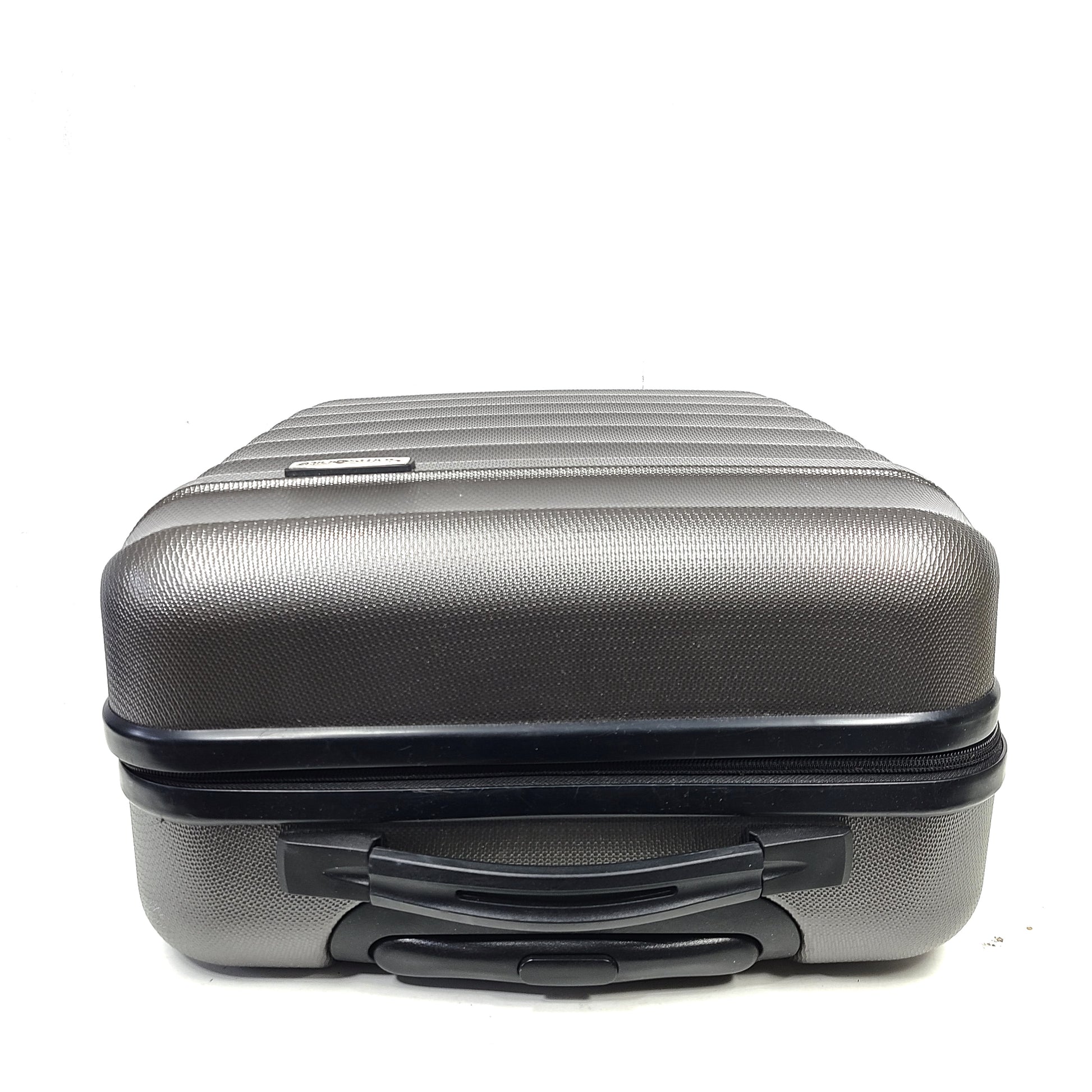 Gray ESPACE carry-on luggage constructed from polyethylene vinyl acetate with scuffs and an intact interior.