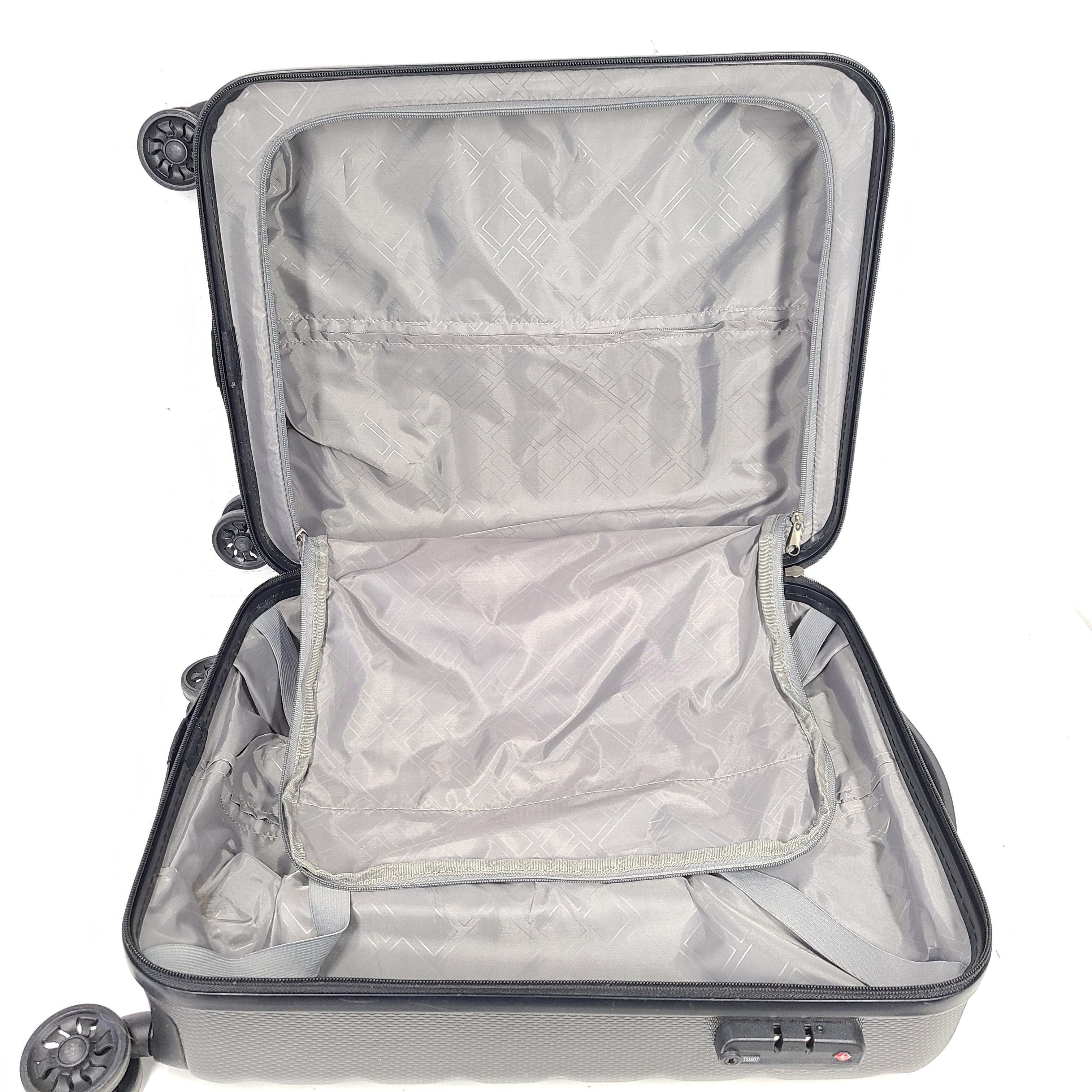 Gray ESPACE carry-on luggage constructed from polyethylene vinyl acetate with scuffs and an intact interior.