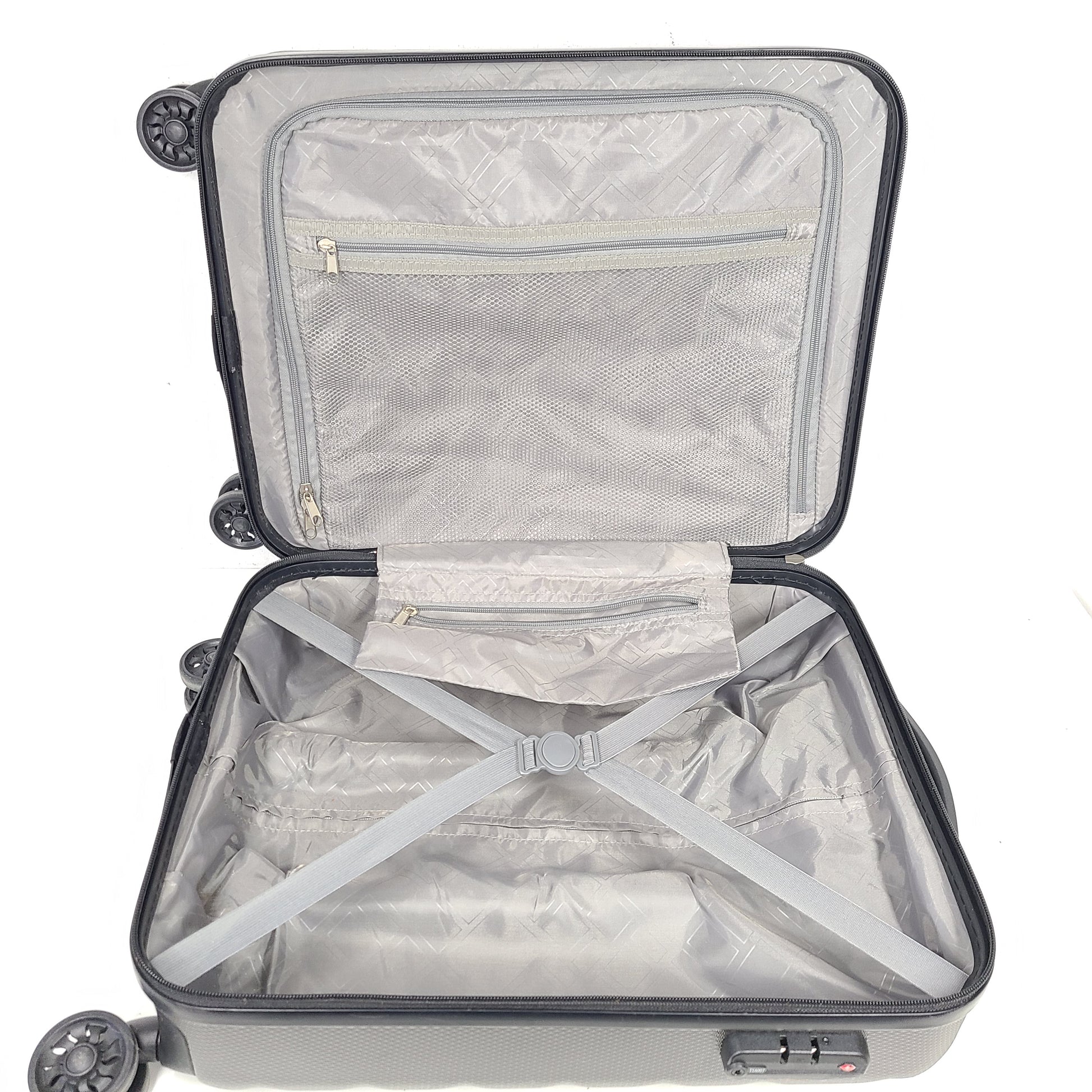 Gray ESPACE carry-on luggage constructed from polyethylene vinyl acetate with scuffs and an intact interior.