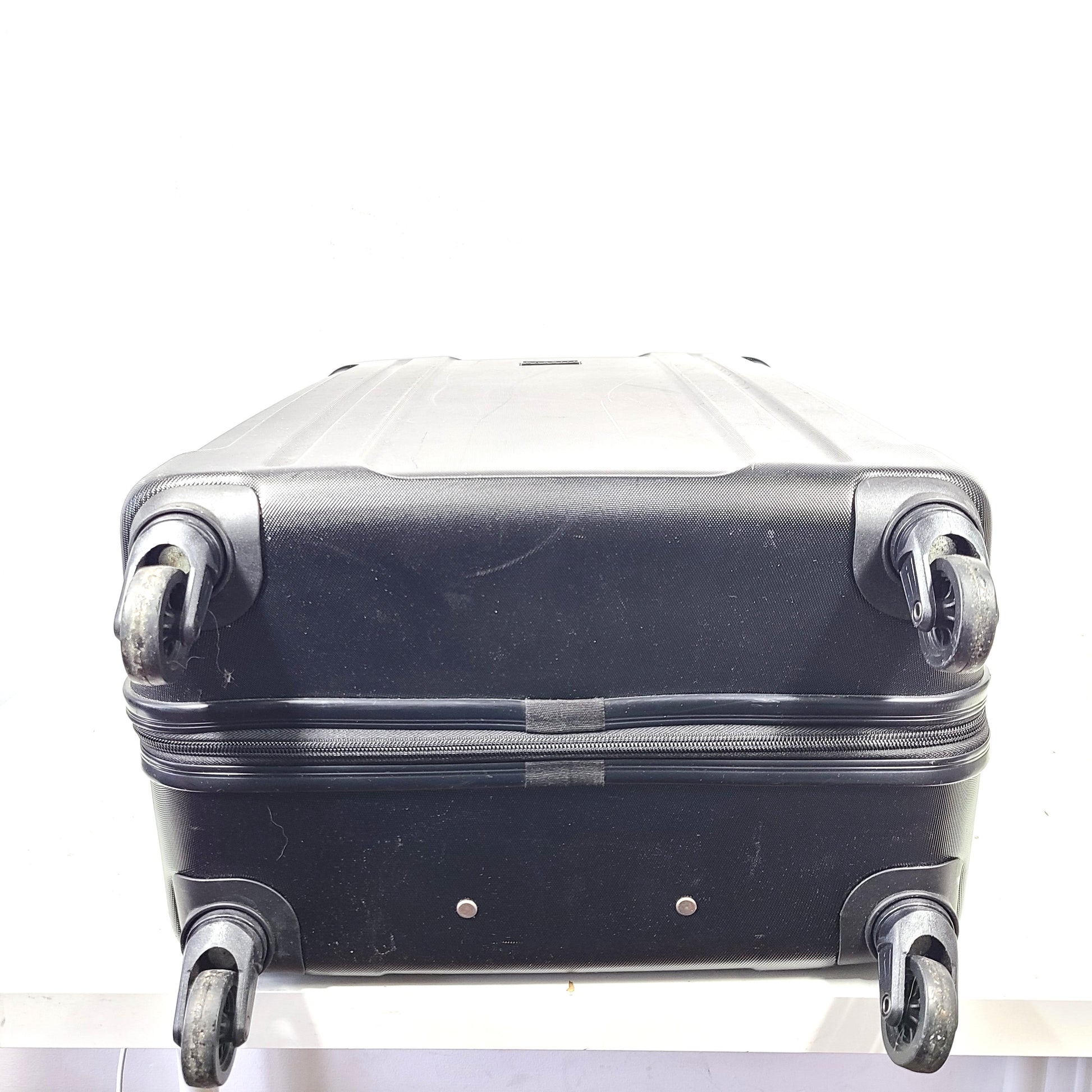 Black ABS/PC hardshell luggage HLG1602 by InUSA with minor surface wear and light scratches.